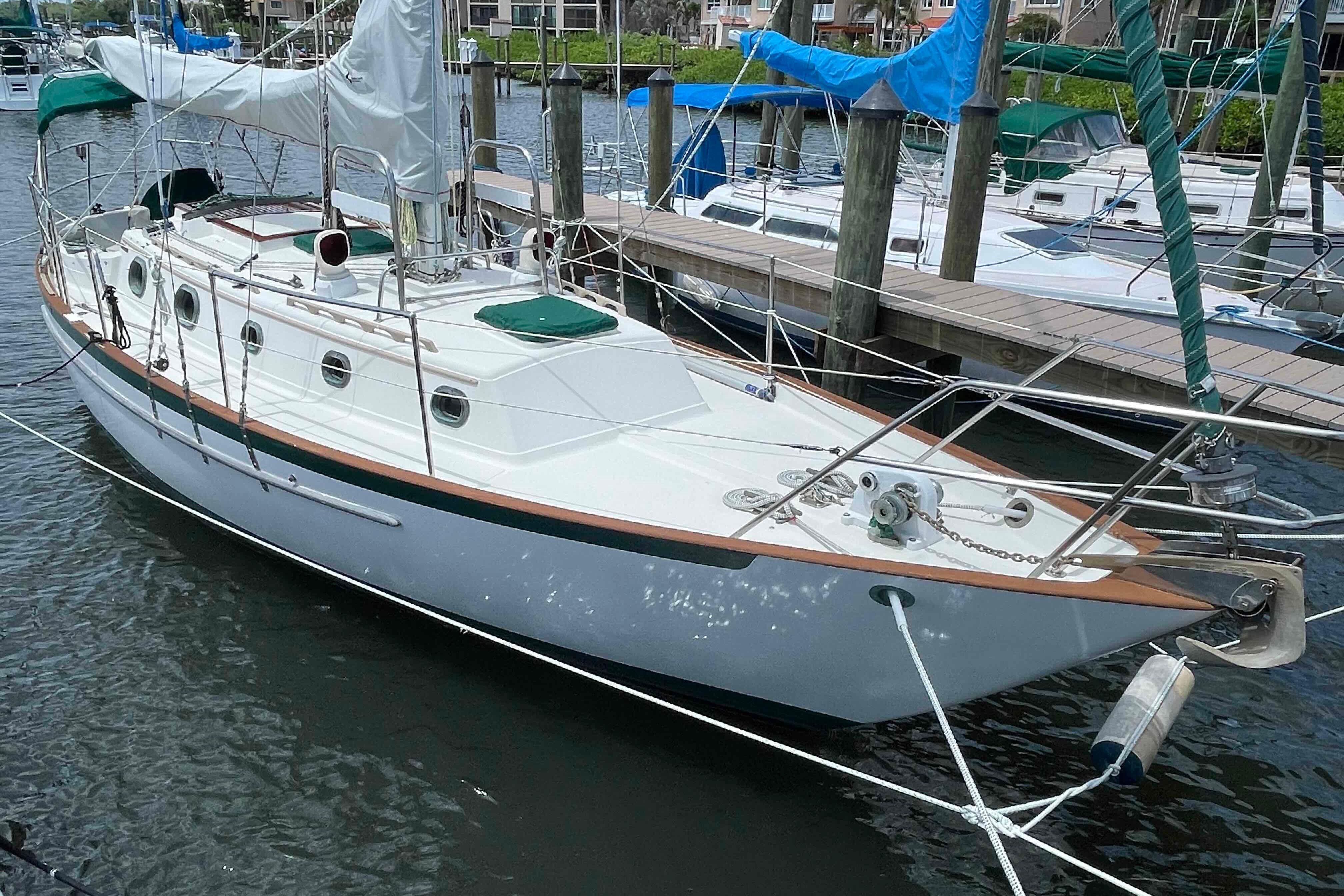 1987 Pacific Seacraft 34 sailboat docked in a marina, showcasing classic design and craftsmanship.