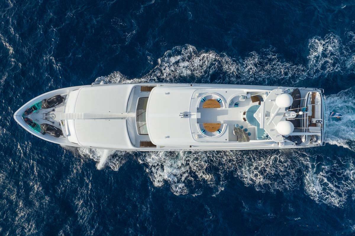 Aerial view of 2001 Westship Skylounge yacht cruising on the ocean.