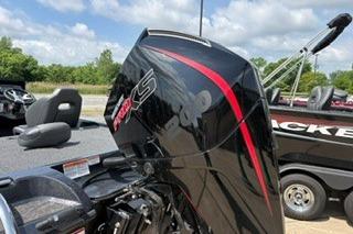 2026 Nitro Z19 XL boat with powerful outboard motor, parked outdoors under a cloudy sky.