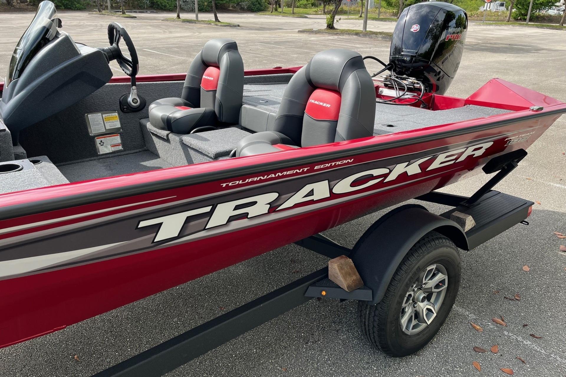 2025 Tracker Pro Team 195 Tournament Edition boat, red with sleek design and comfortable seating.