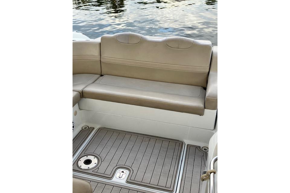 2009 Formula 350 Sun Sport boat interior with beige seating and teak-style flooring.