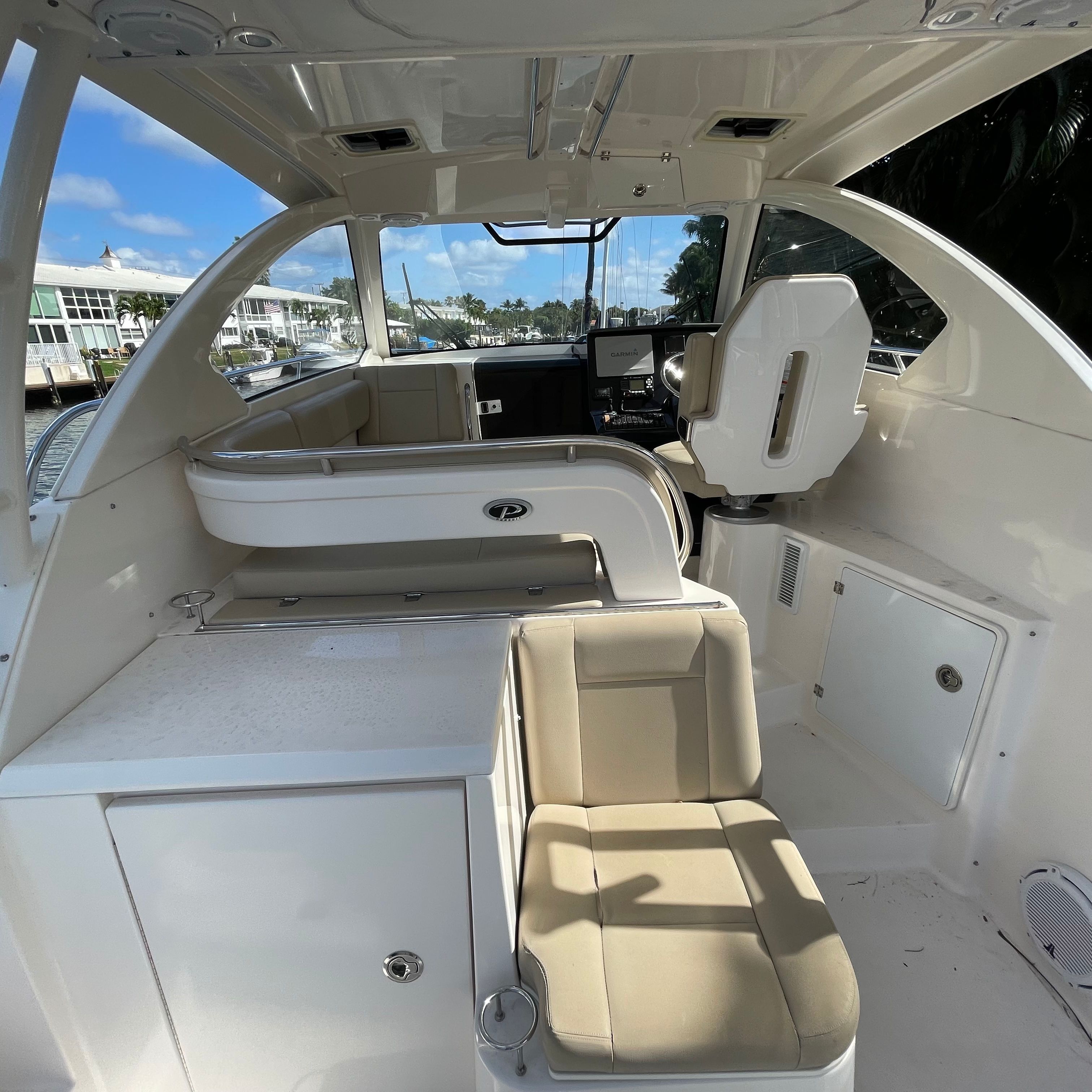 Interior of 2016 Pursuit OS 325 Offshore with seating area.