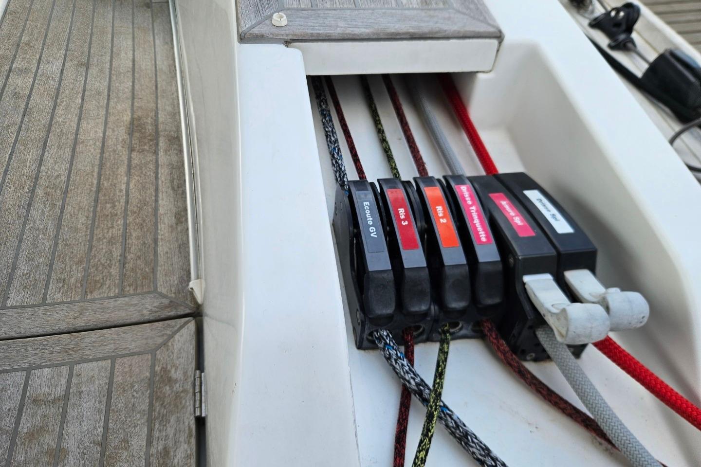 Control panel with labeled ropes on a 2013 CNB BORDEAUX 60 yacht deck.
