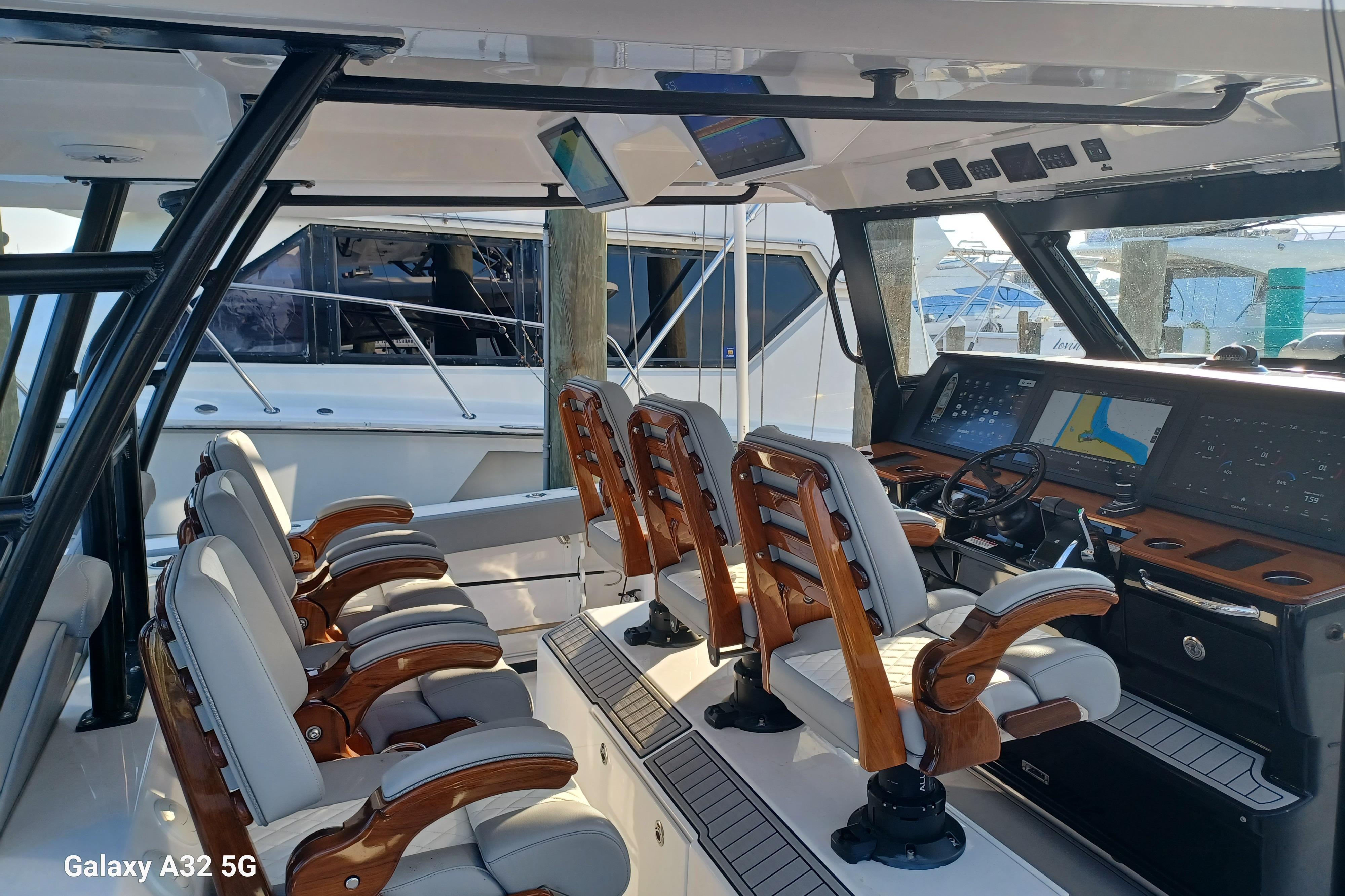 2024 Everglades 455 Center Console boat interior with luxurious seating and advanced navigation displays.