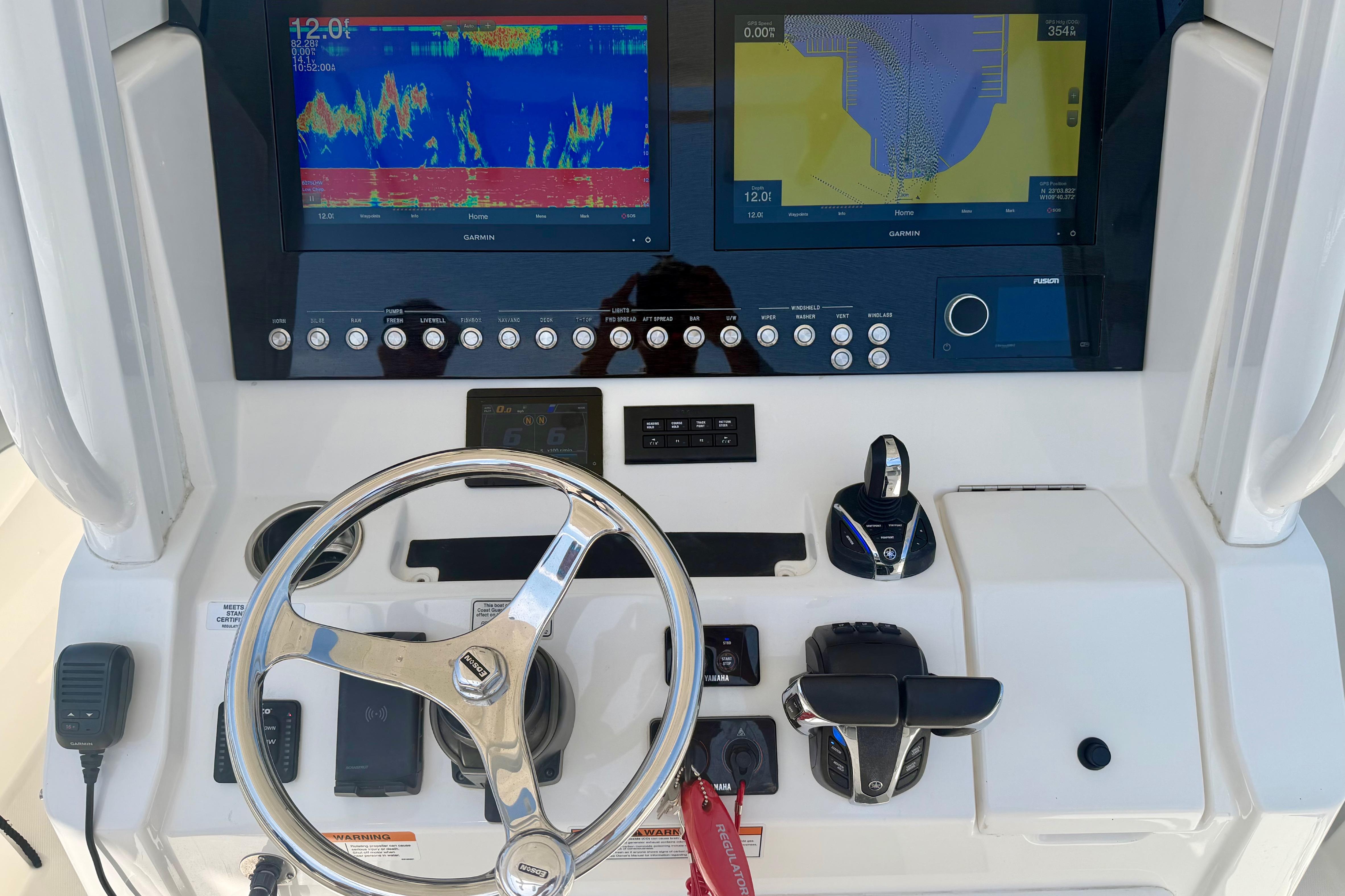 Helm of 2022 Regulator 28 boat with advanced navigation and control systems.