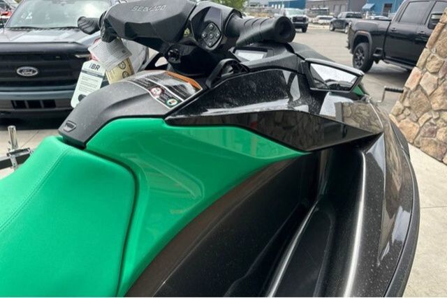 Close-up of a Sea-Doo PWC GTR 230 with green and black design.