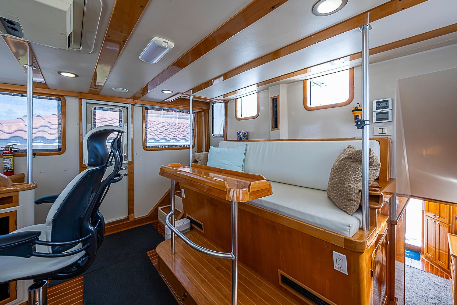 Interior of 2003 Magna Marine Nova Scotia 47, featuring seating and helm station.