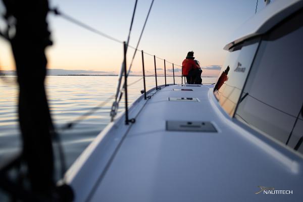 2025 Nautitech 48 Open sailing at sunset with calm waters and serene atmosphere.