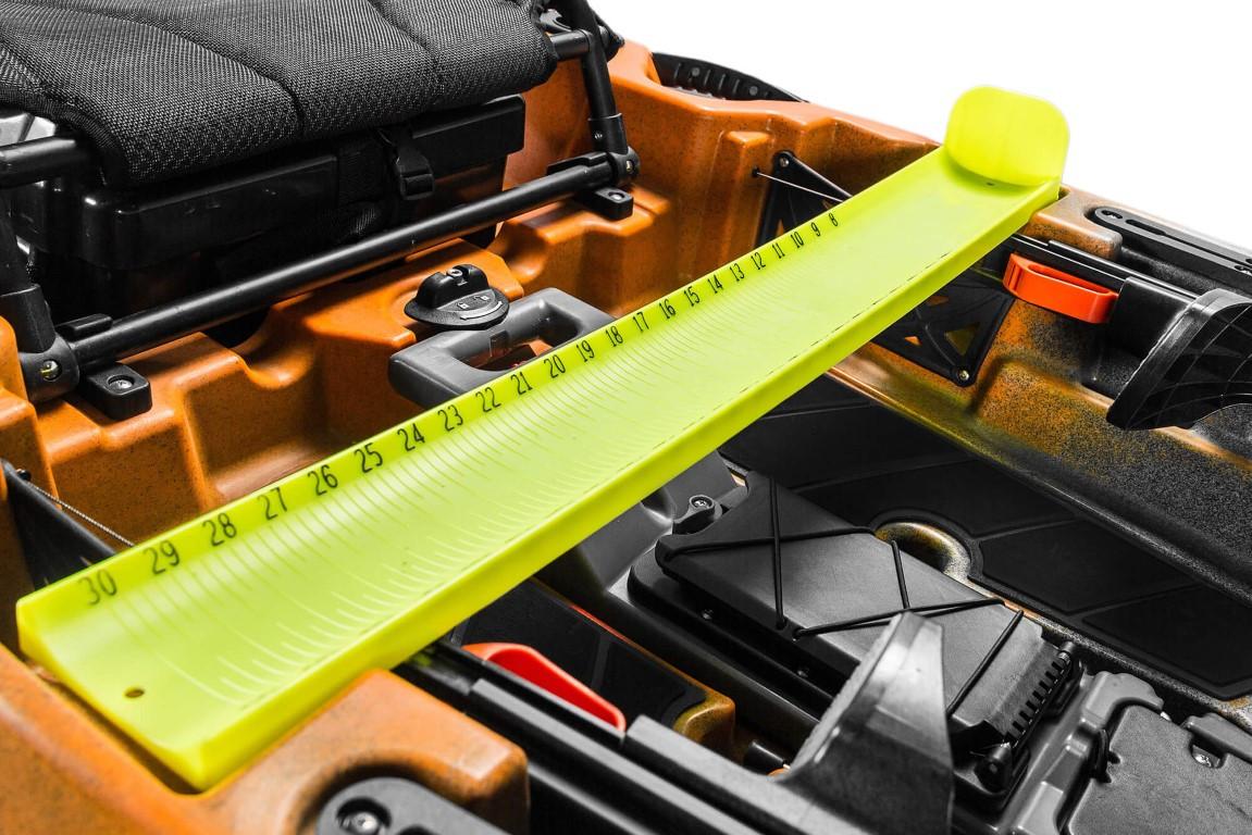 2023 Old Town 106 Sportsman kayak with measuring board and storage compartments.