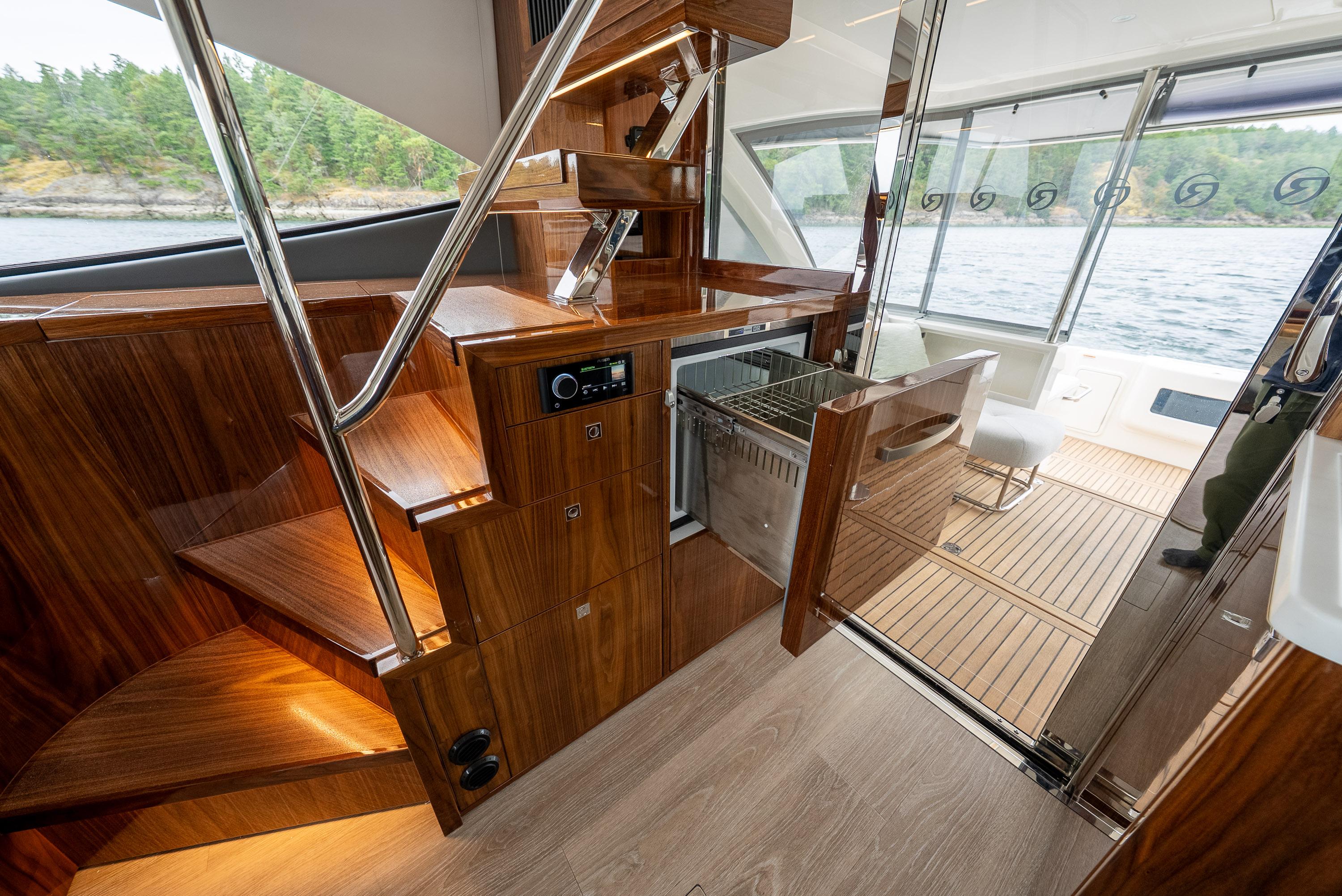 2025 Riviera 50 Sports Motor Yacht interior with sleek wood finish and modern amenities.