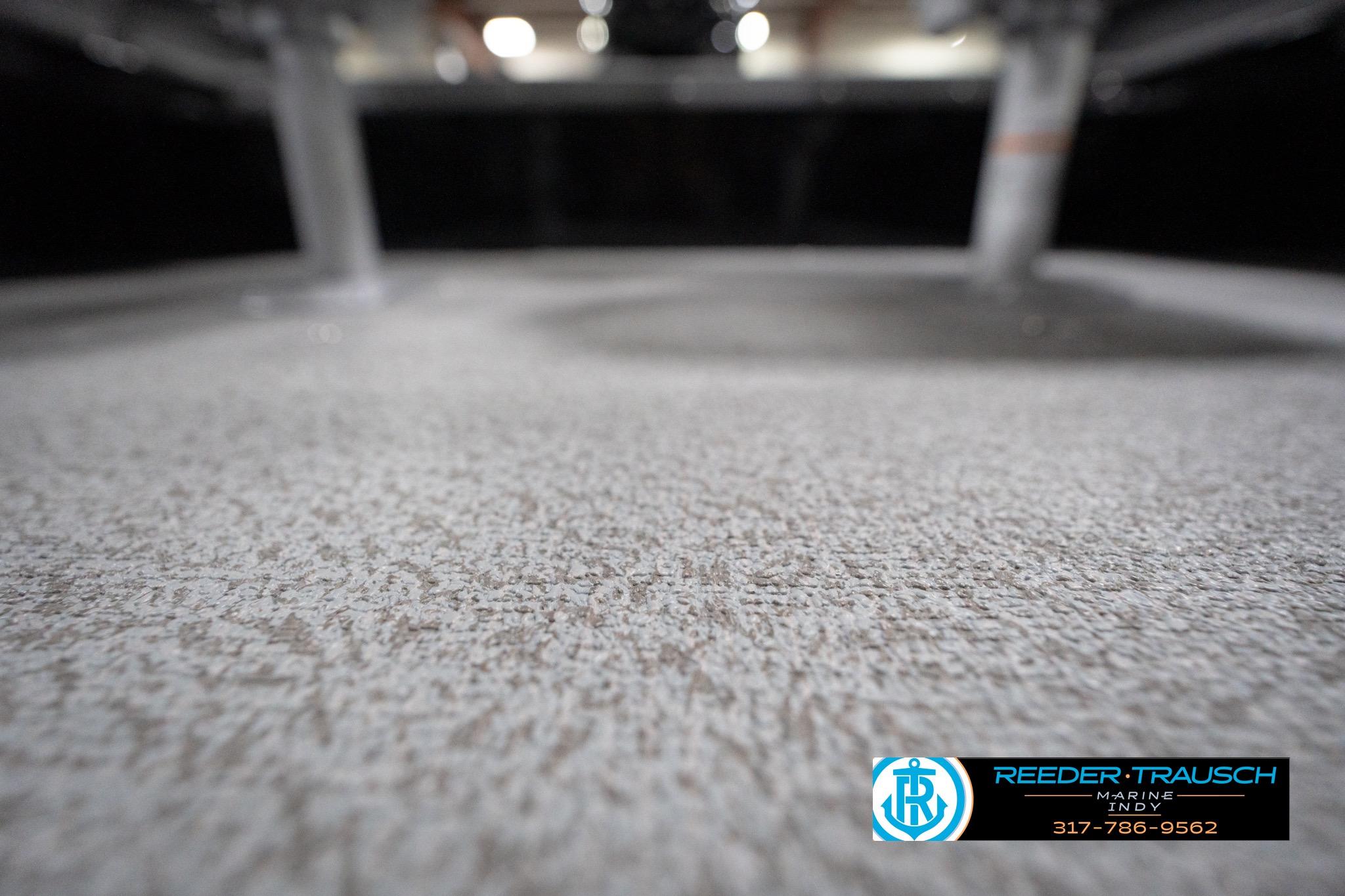 2026 Lund 1800 Explorer Sport boat interior with textured flooring, Reeder-Trausch Marine logo.