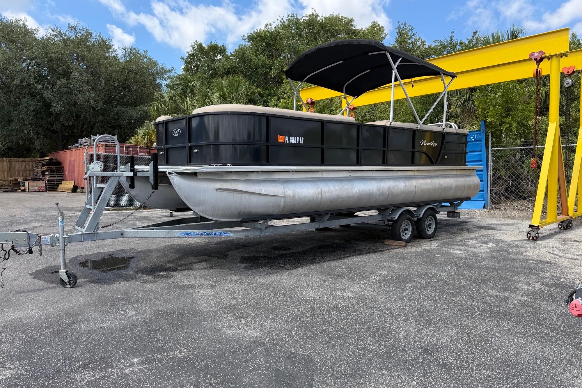 2022 Bentley Pontoons 240 CRUISE on trailer, parked outdoors under a blue sky.