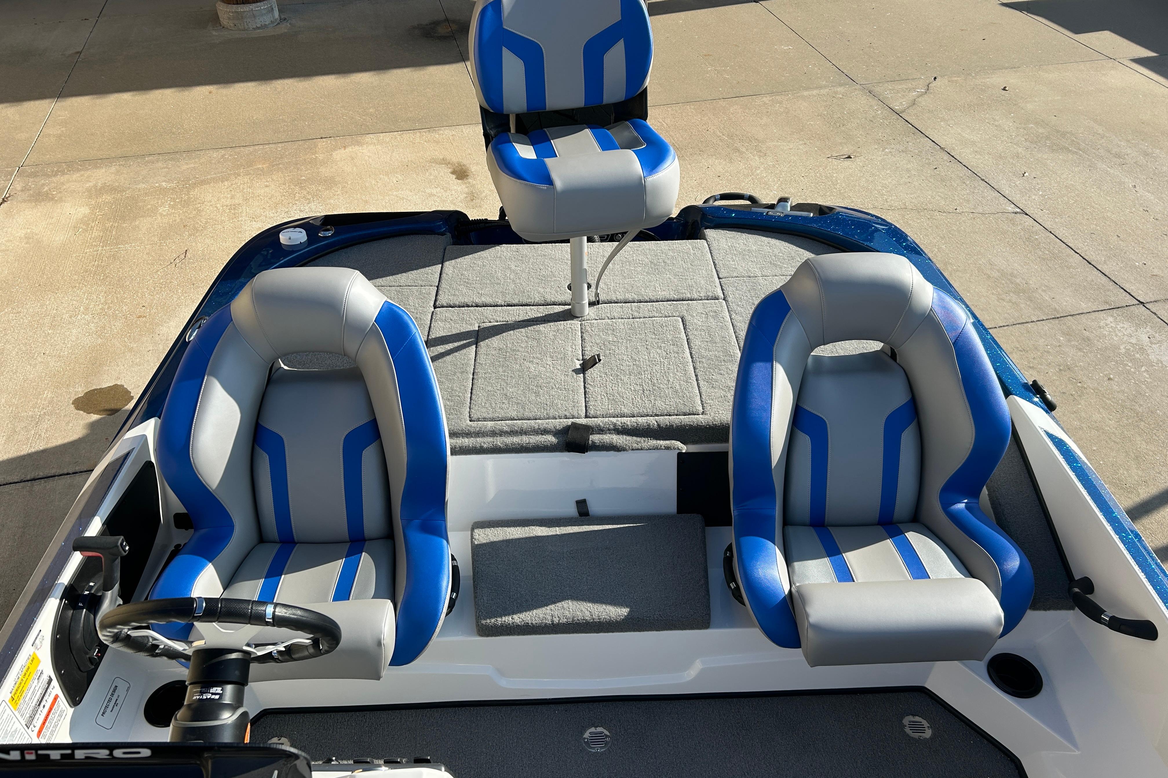 Interior of 2025 Nitro Z18 Pro boat with blue and gray seating.