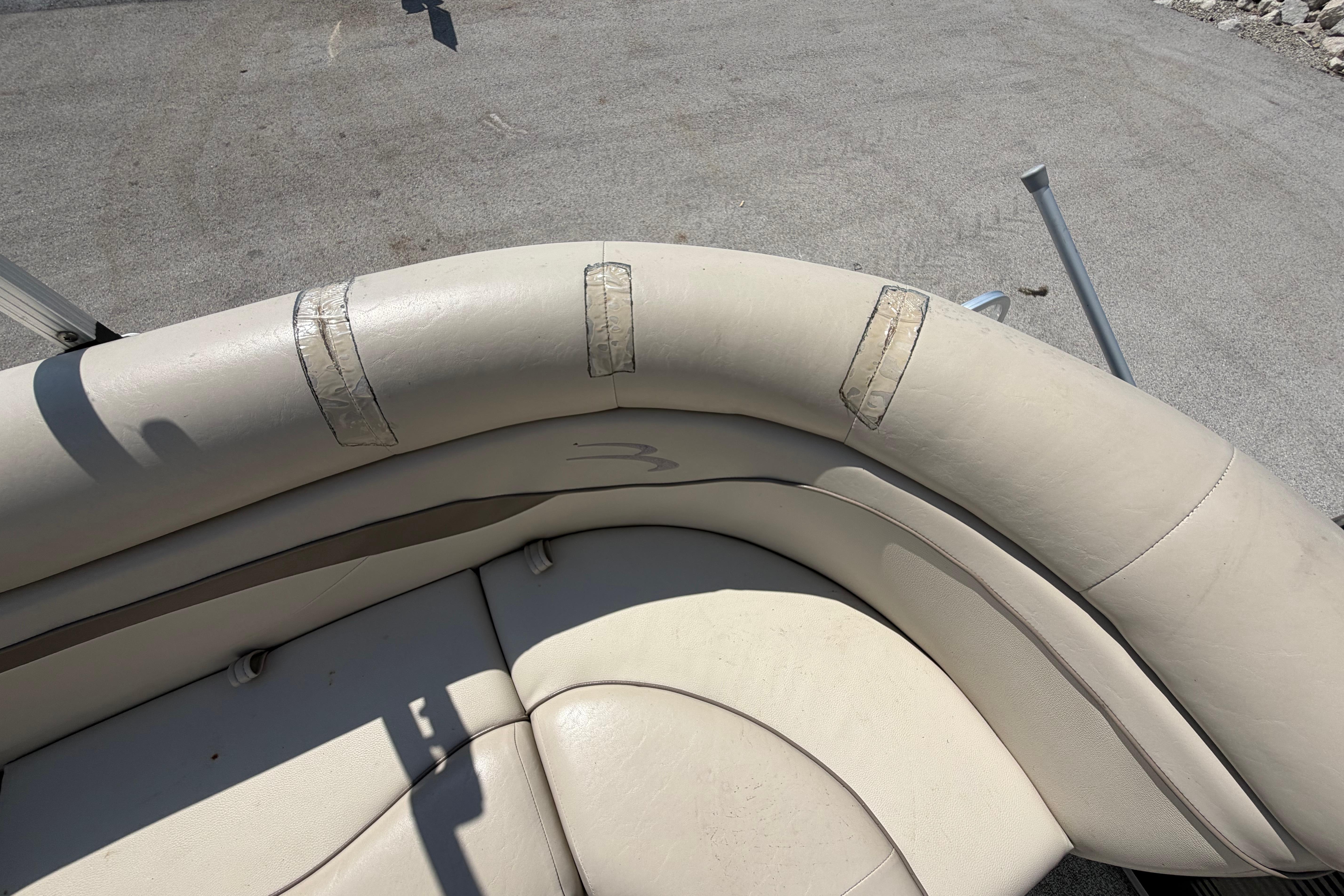 2017 Bennington 25 SSXAPG boat interior with taped beige seating.
