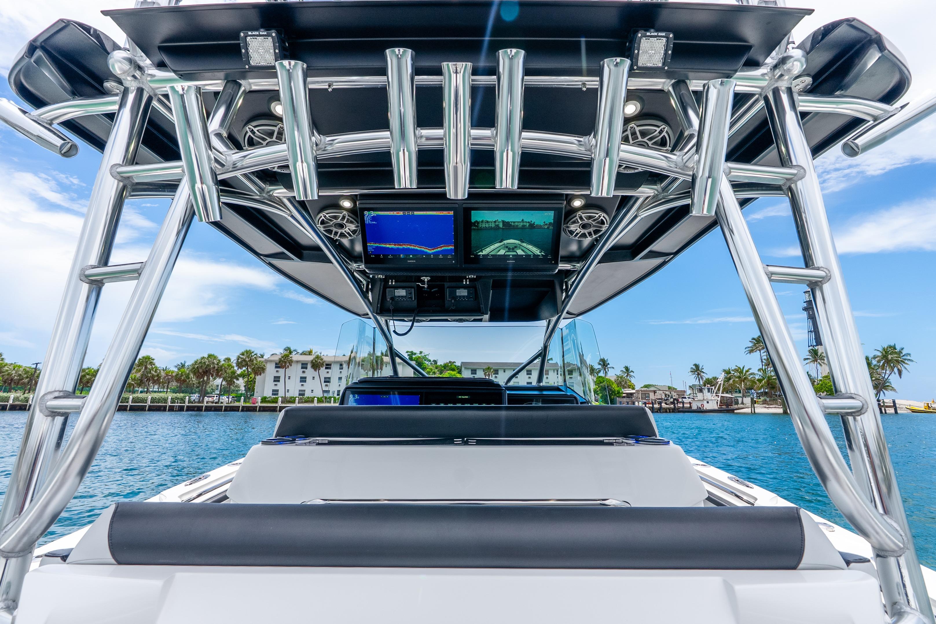 2024 Nor-Tech 452 Super Fish boat with advanced navigation screens on a sunny day.
