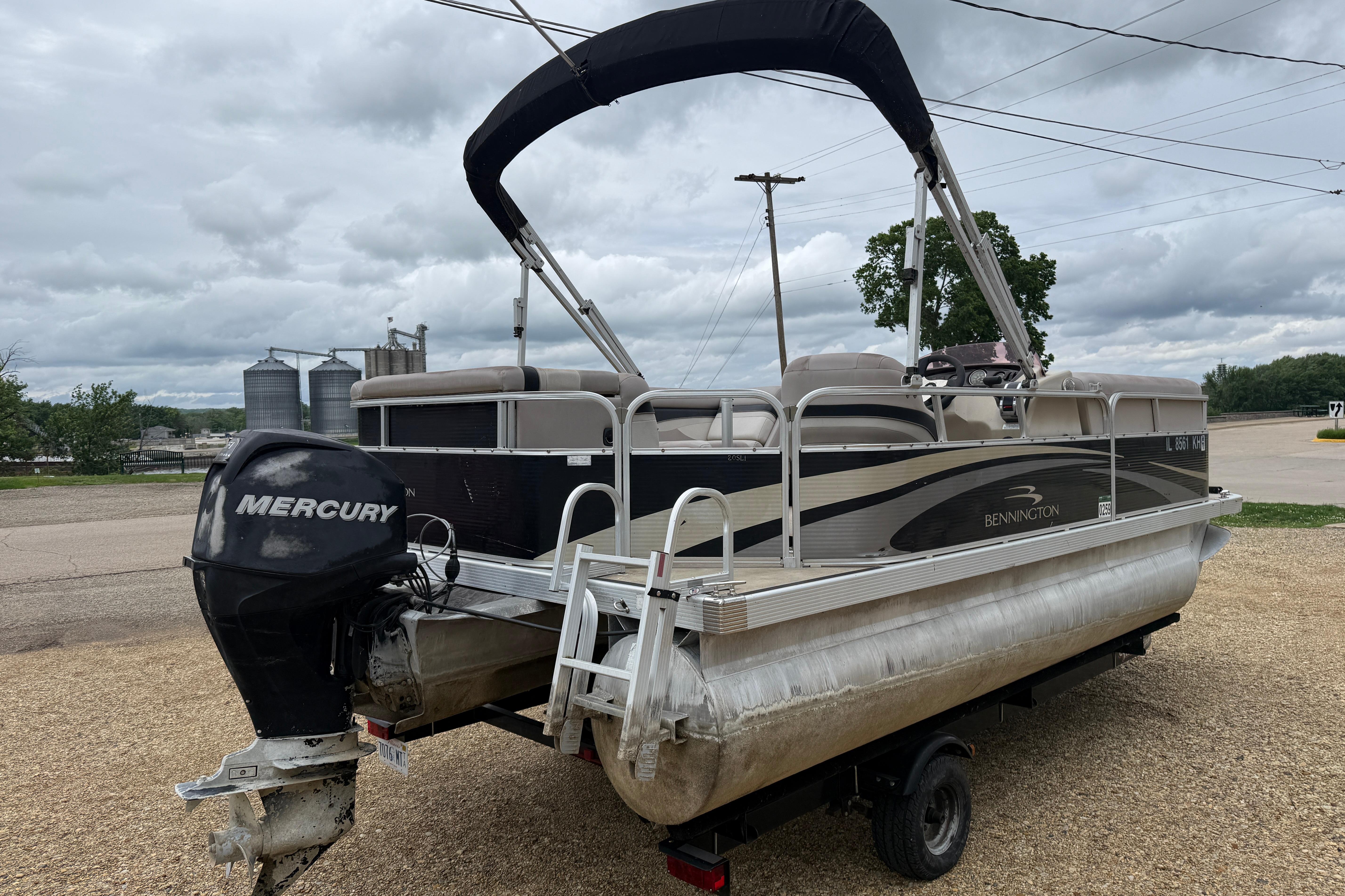2010 Bennington 20SLi pontoon boat with Mercury outboard motor on trailer.