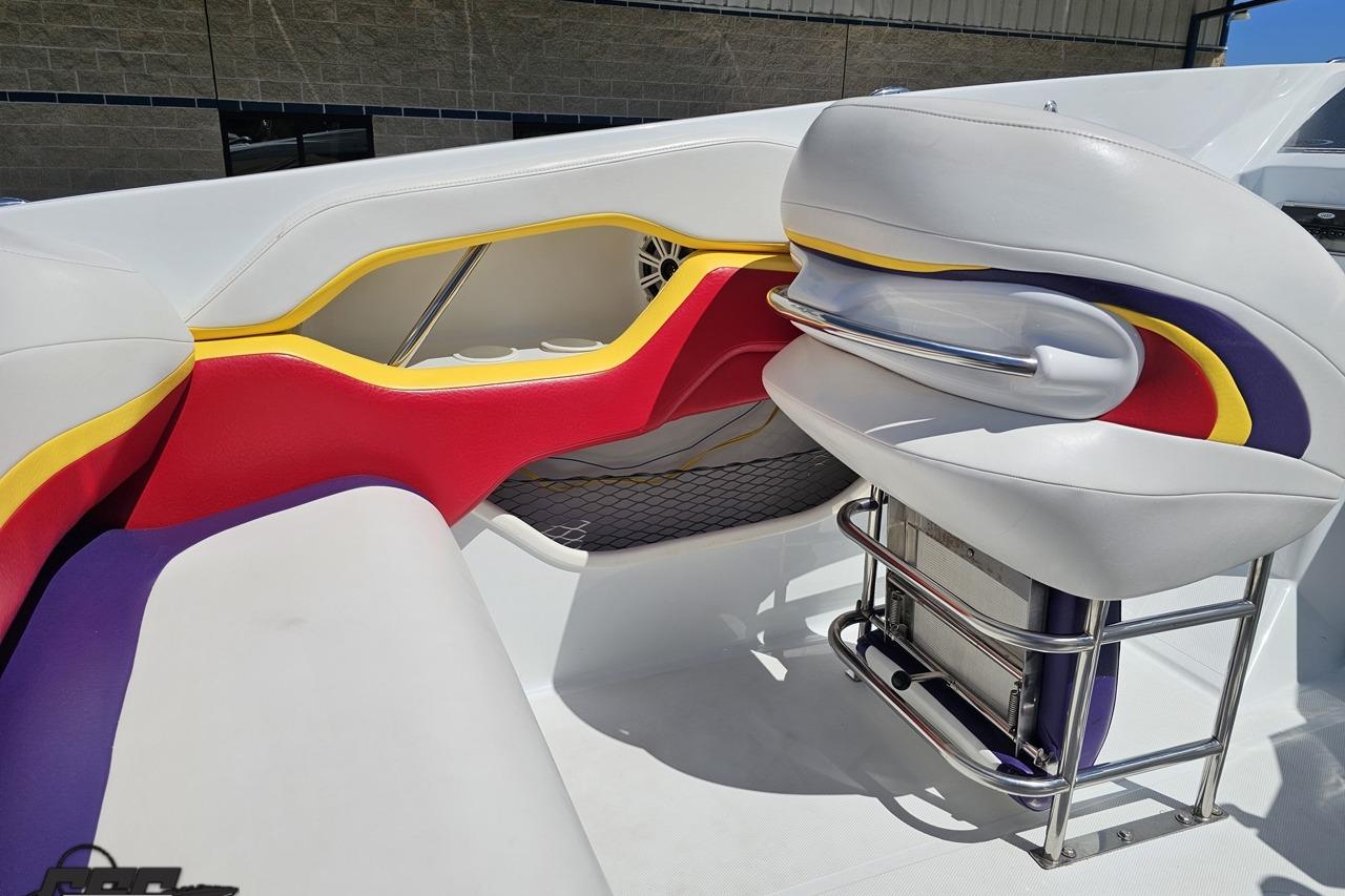 Interior of a 2005 Baja 30 Outlaw boat with colorful seating design.