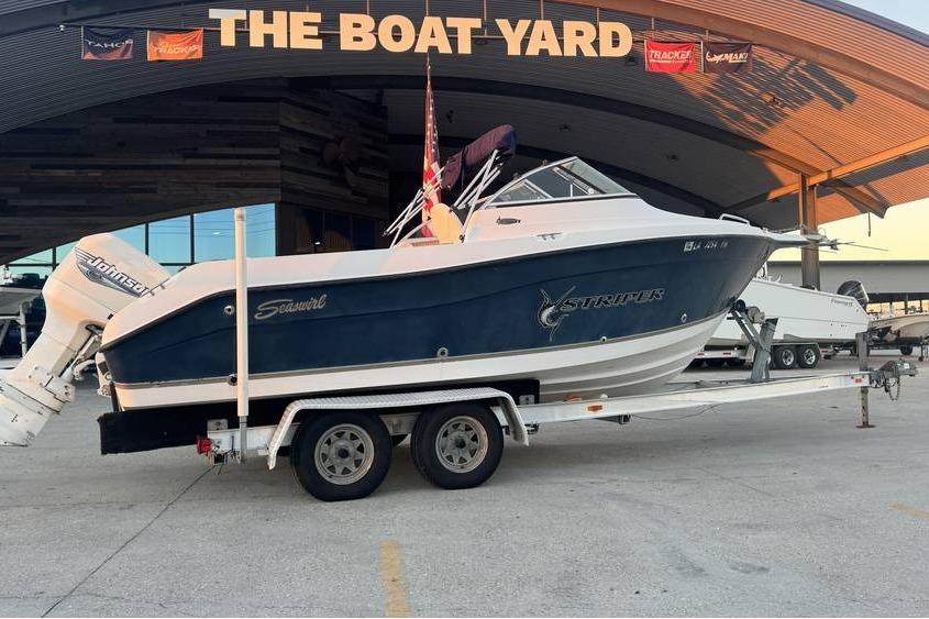 2006 Seaswirl Striper 2101 Dual Console OB on trailer at The Boat Yard.