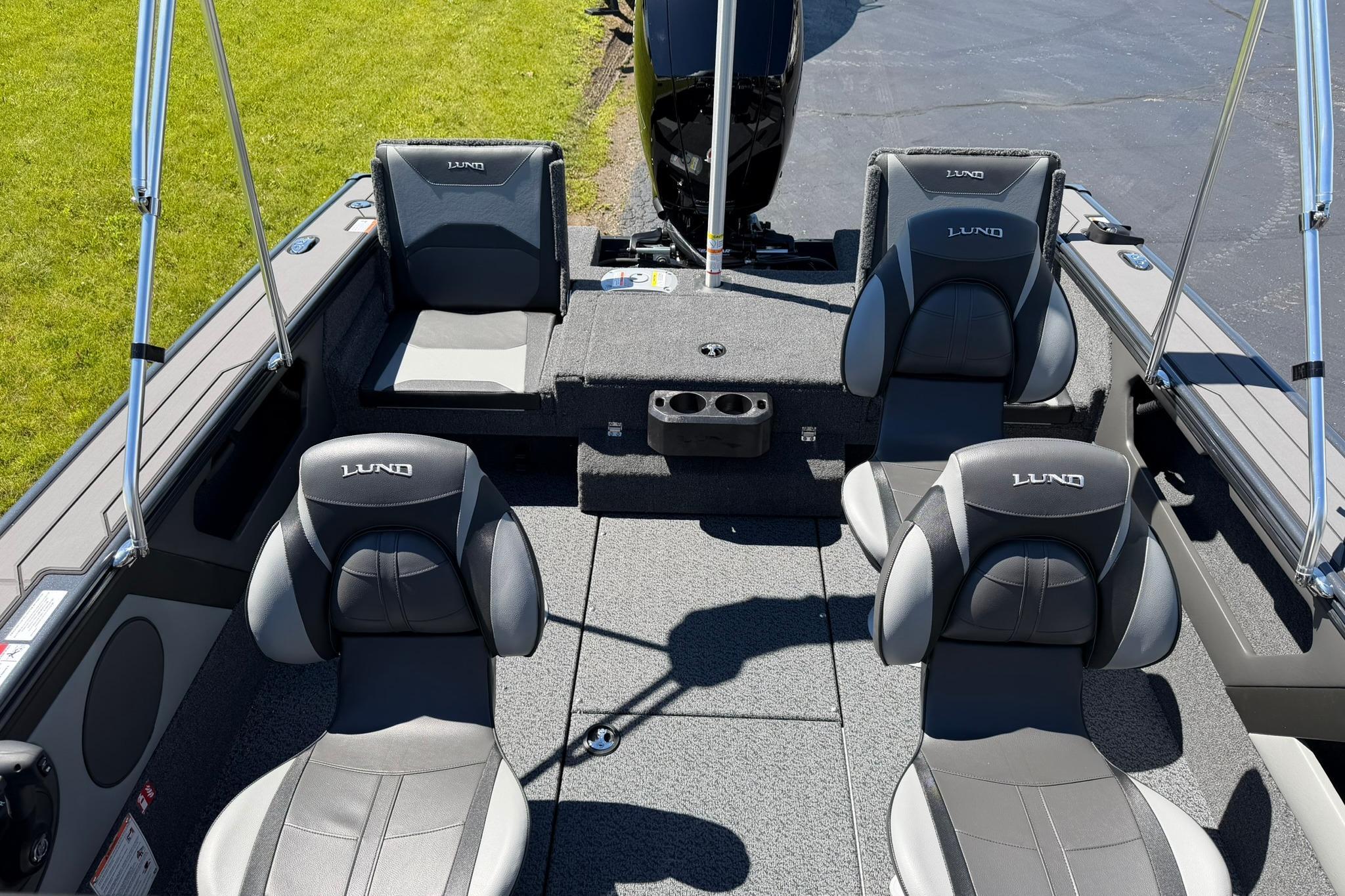 2027 Lund 1775 Crossover XS boat interior with gray seating and cup holders.