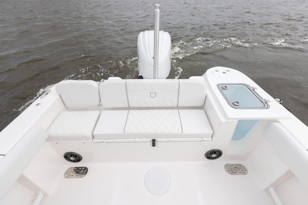 2027 Sea Fox 248 Commander boat interior with white seating and water view.