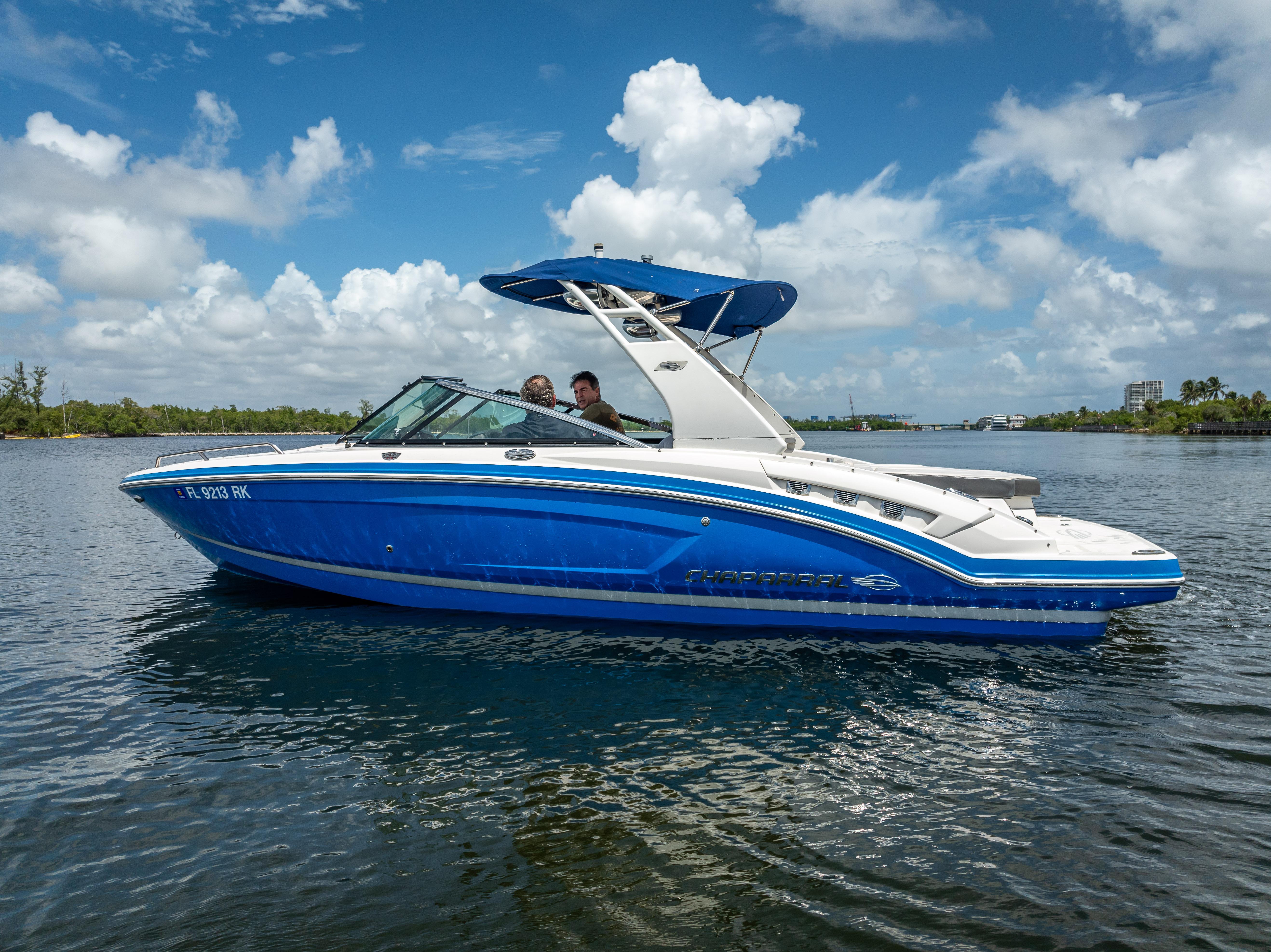 2017 Chaparral 227 SSX boat on water under blue sky.