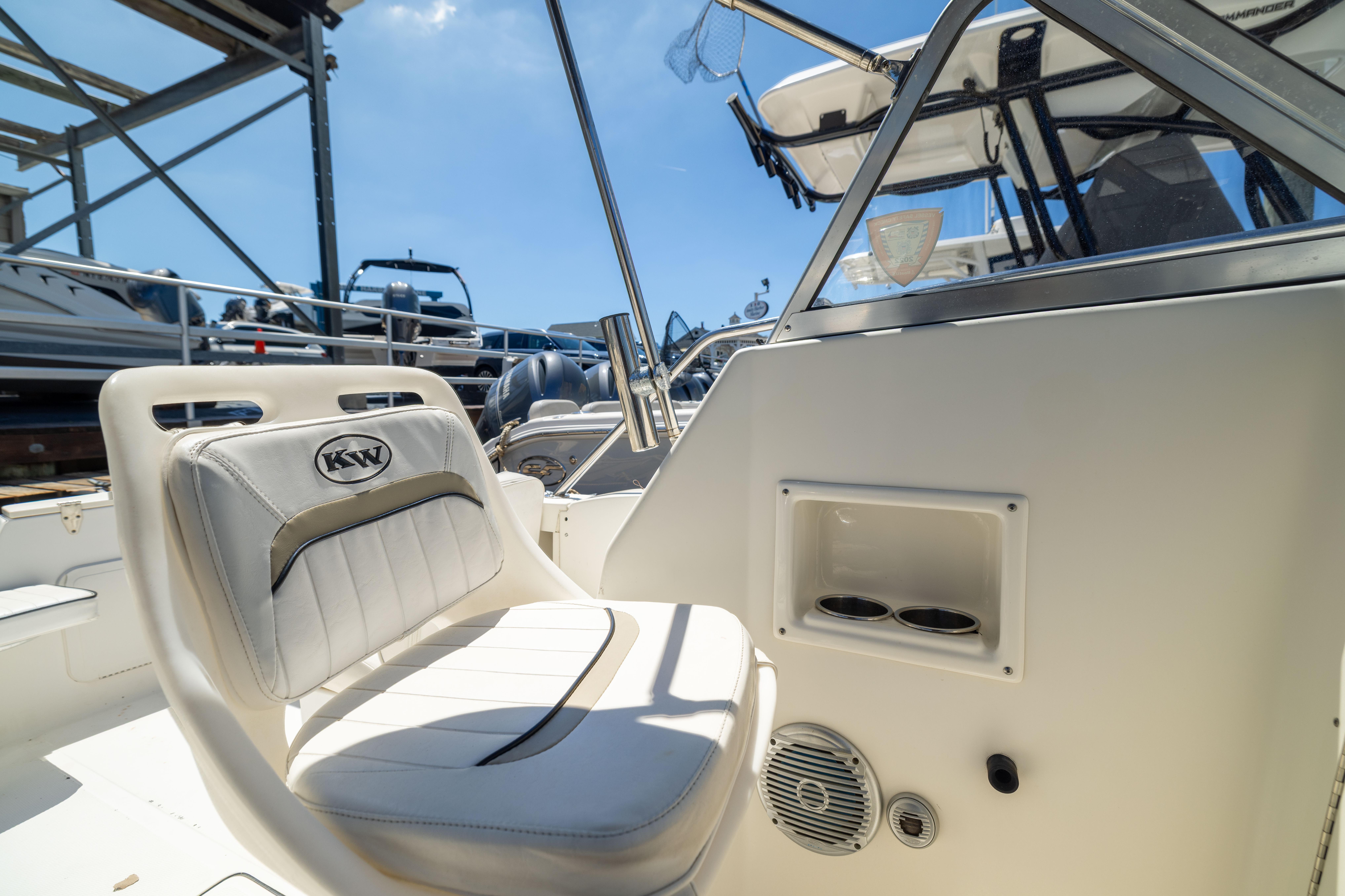 Interior of a 2012 KEYWEST 2020 WA boat with white seating and control panel.