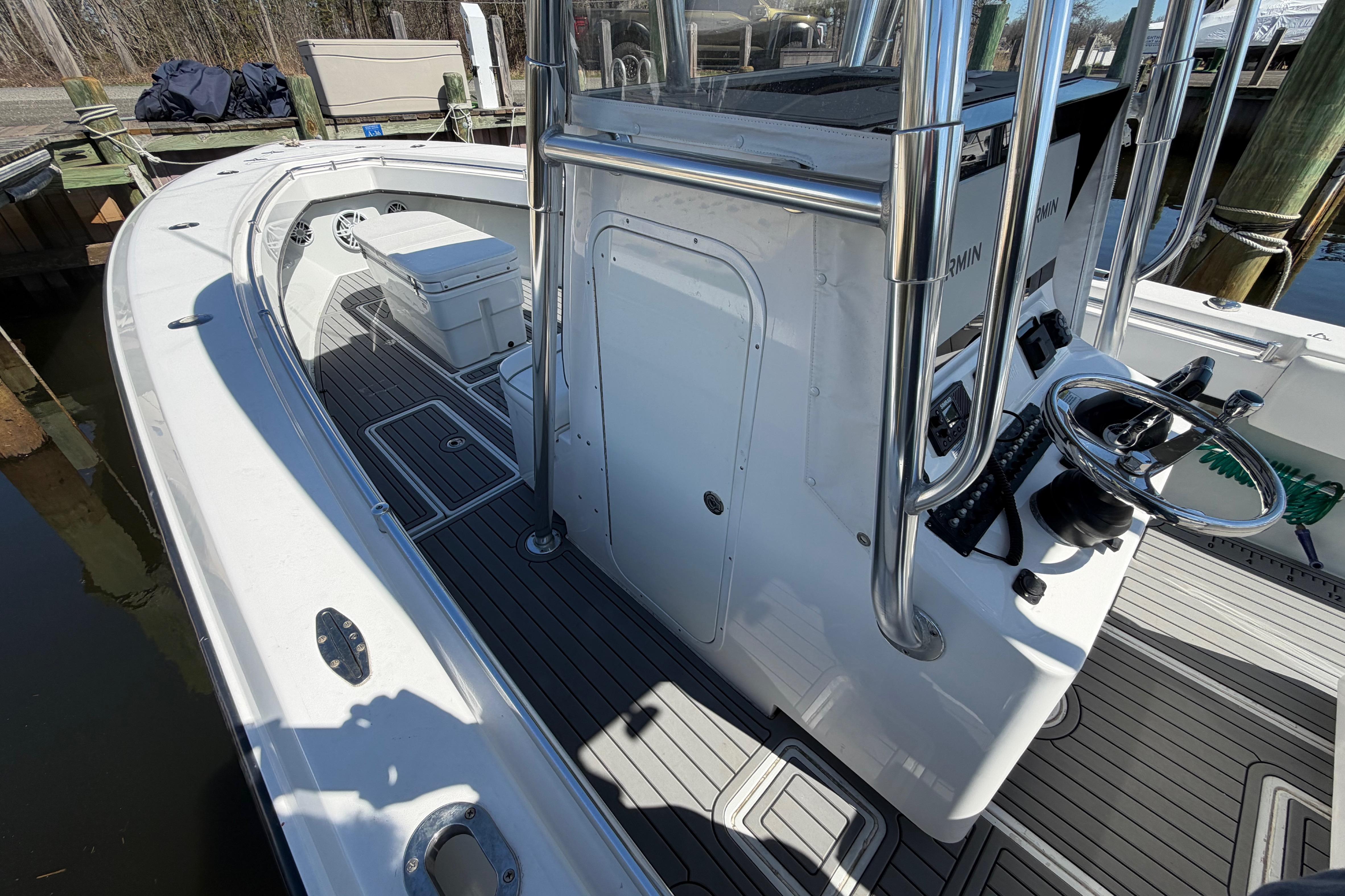 2015 Contender 32 ST boat interior with steering console and seating area.