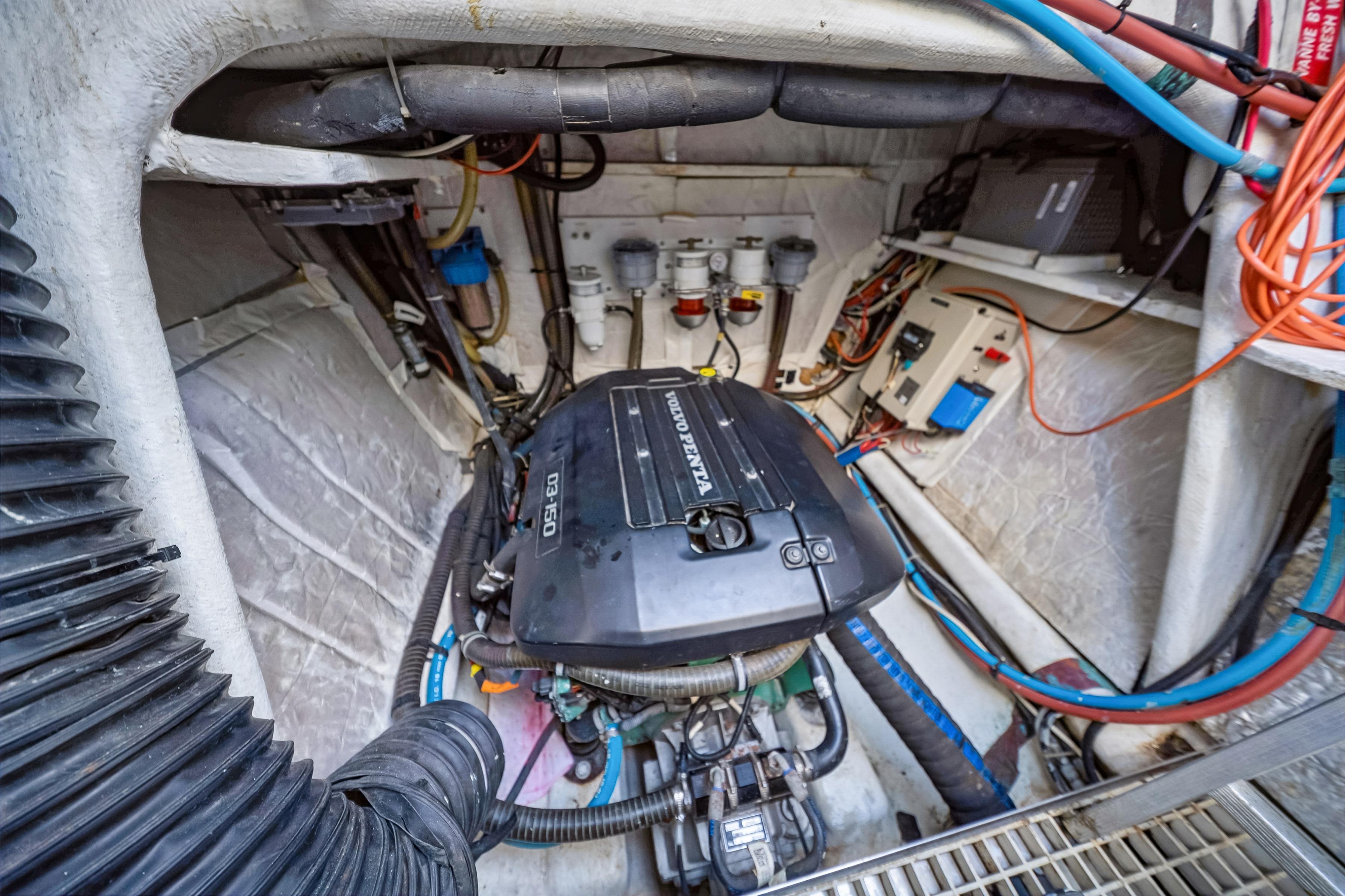 Engine room of a 2009 Catana 65 yacht featuring a Volvo Penta engine.