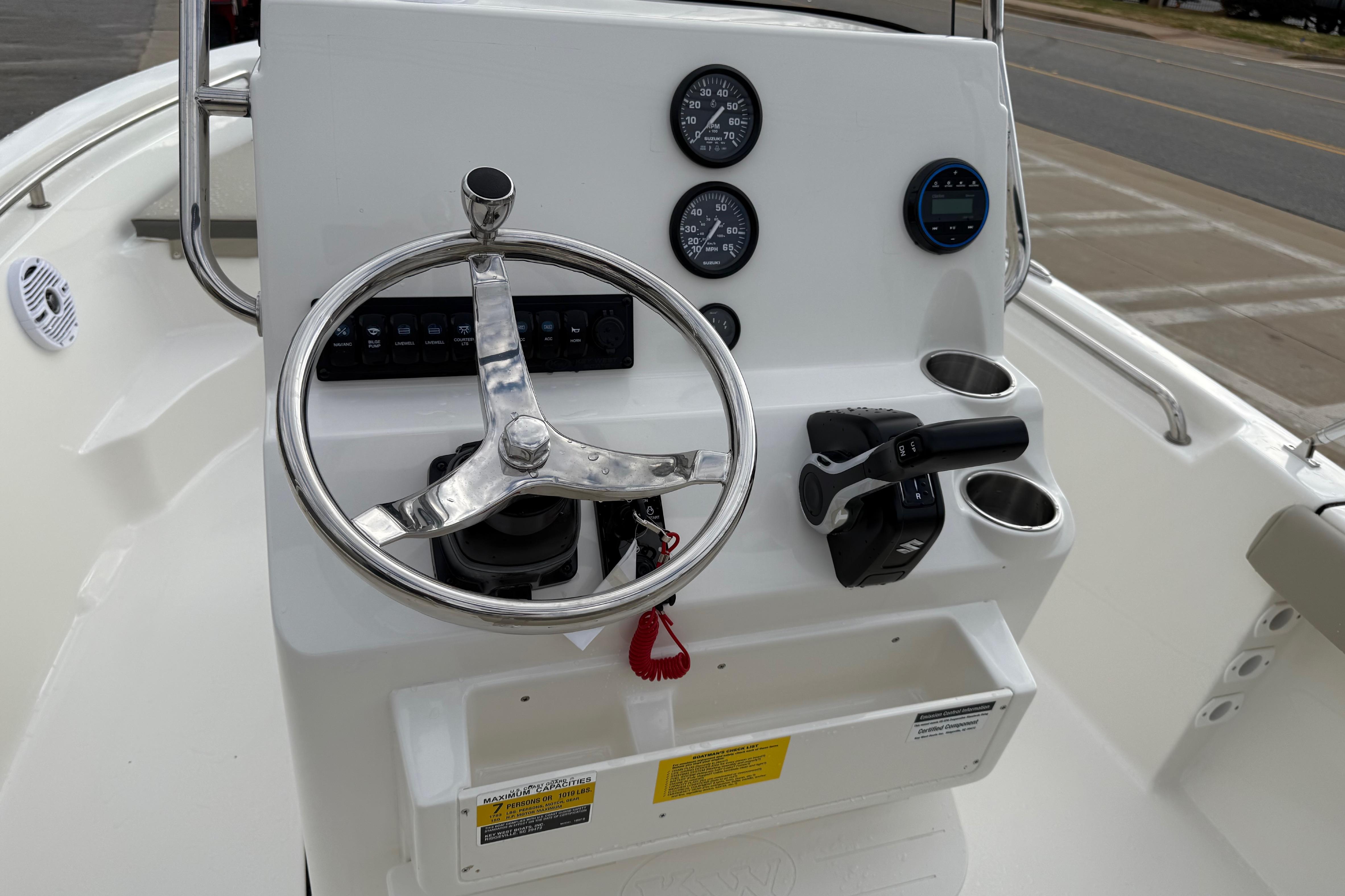 Steering console of 2026 Key West 189 FS boat with gauges and controls.
