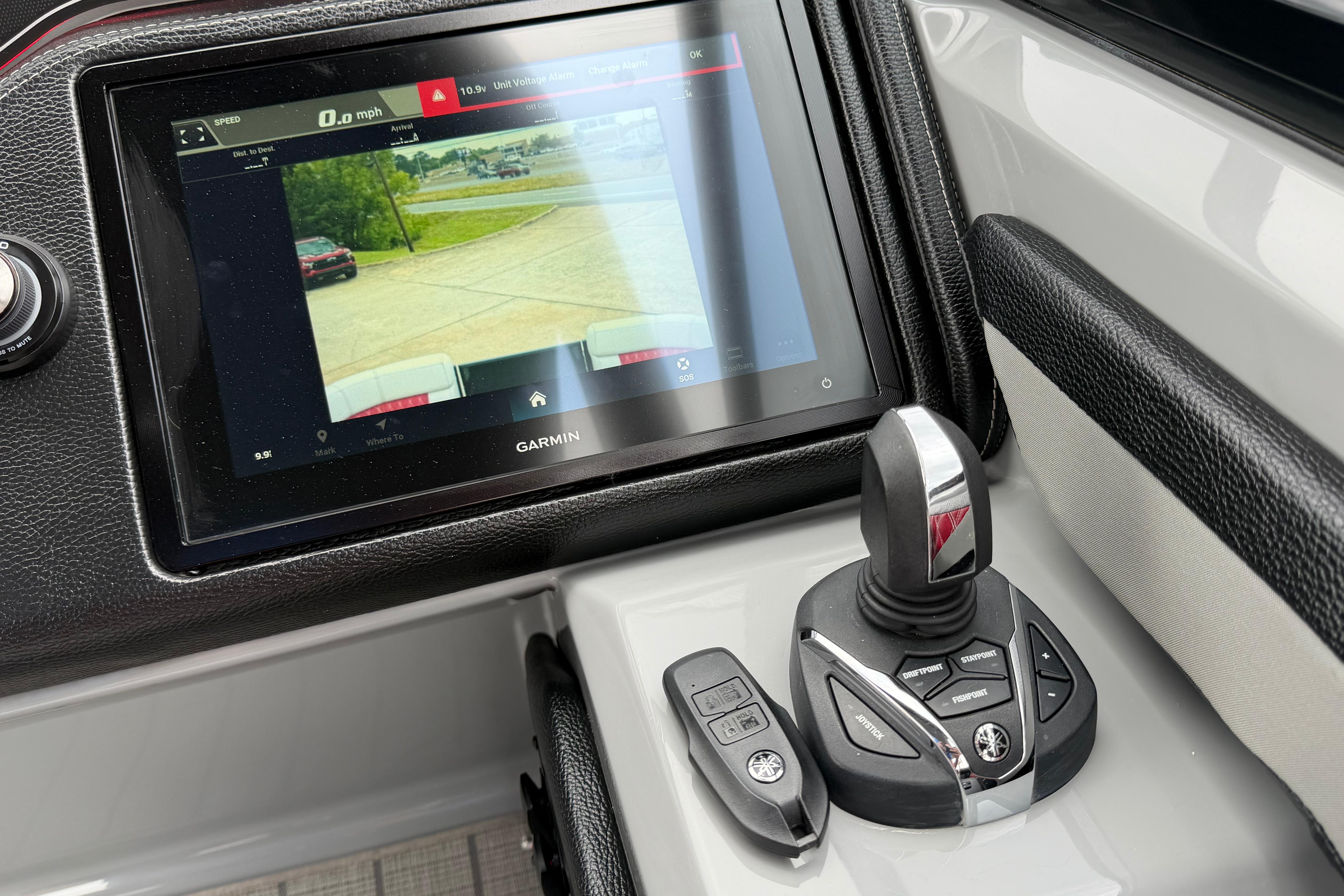 Control panel of 2023 Godfrey Sanpan 2700 ULW Twin with Garmin display and joystick.