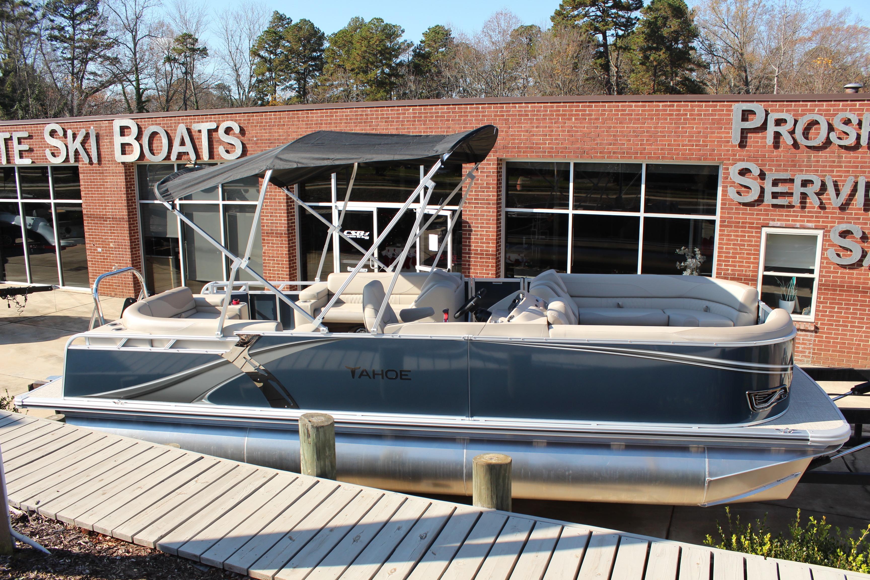 2026 Tahoe Pontoon LTZ Elite boat displayed outside a dealership.