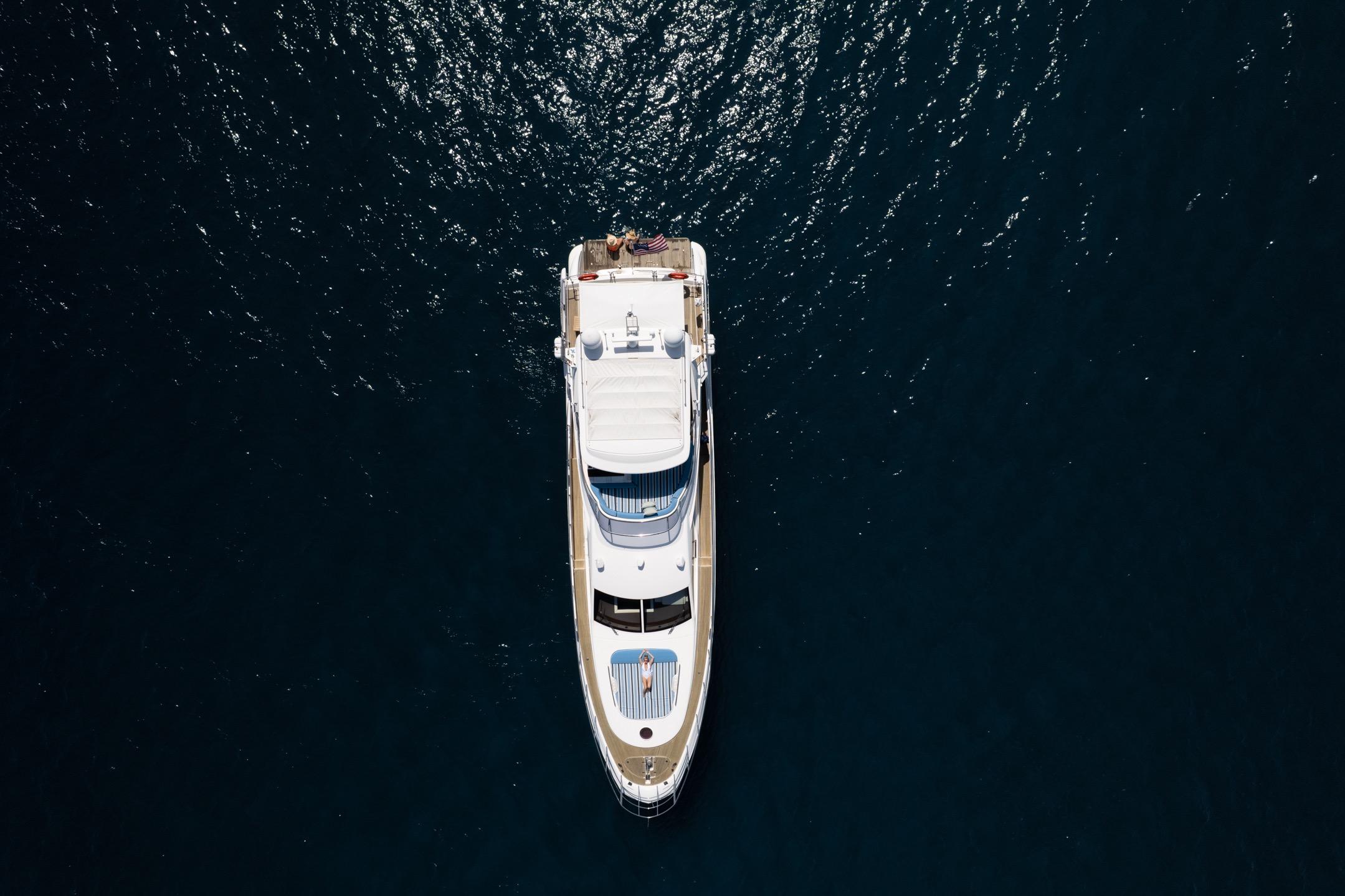 Aerial view of 2011 Azimut 70 yacht on dark blue water.