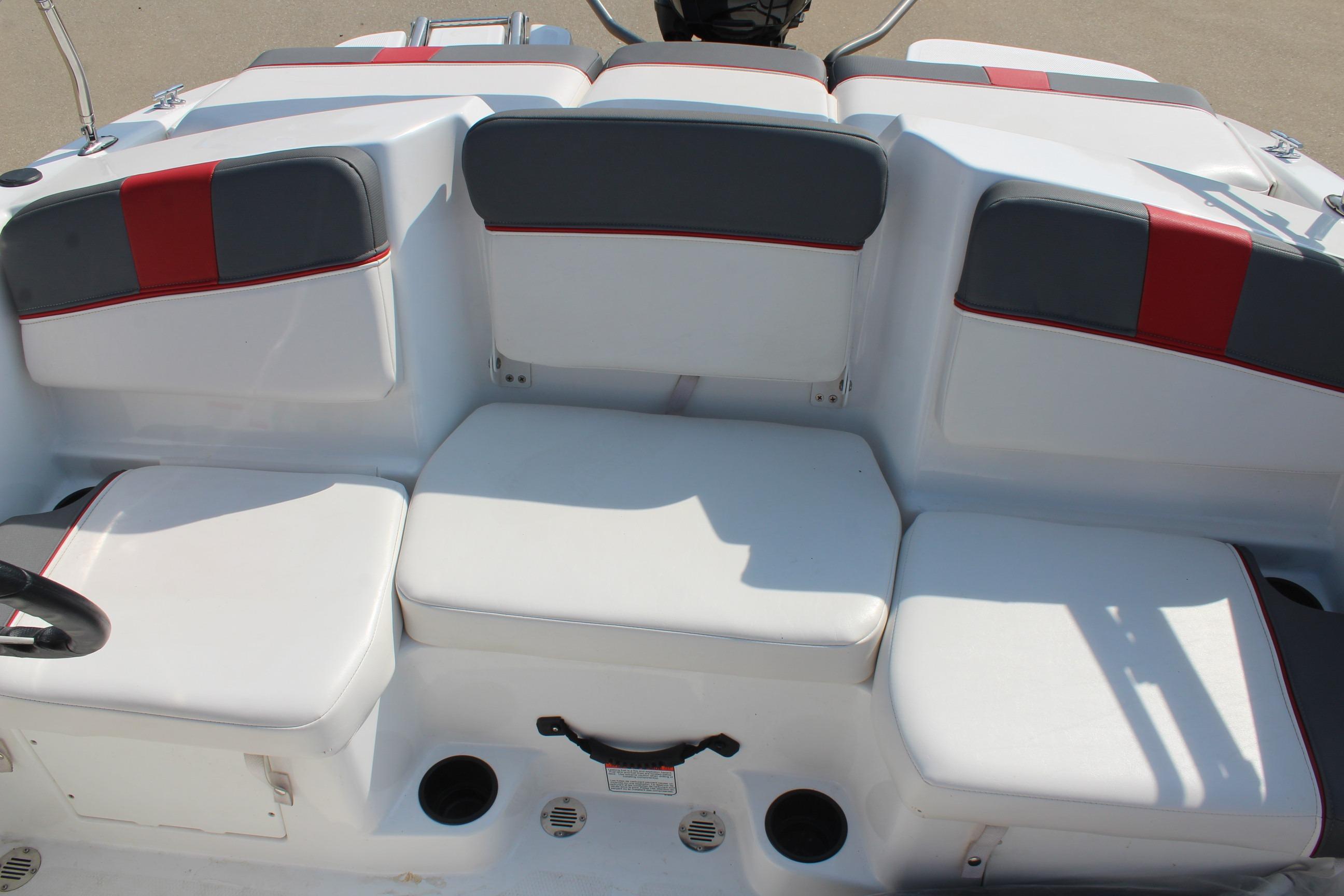 2023 Tahoe T16 boat interior with white and gray seating, red accents.