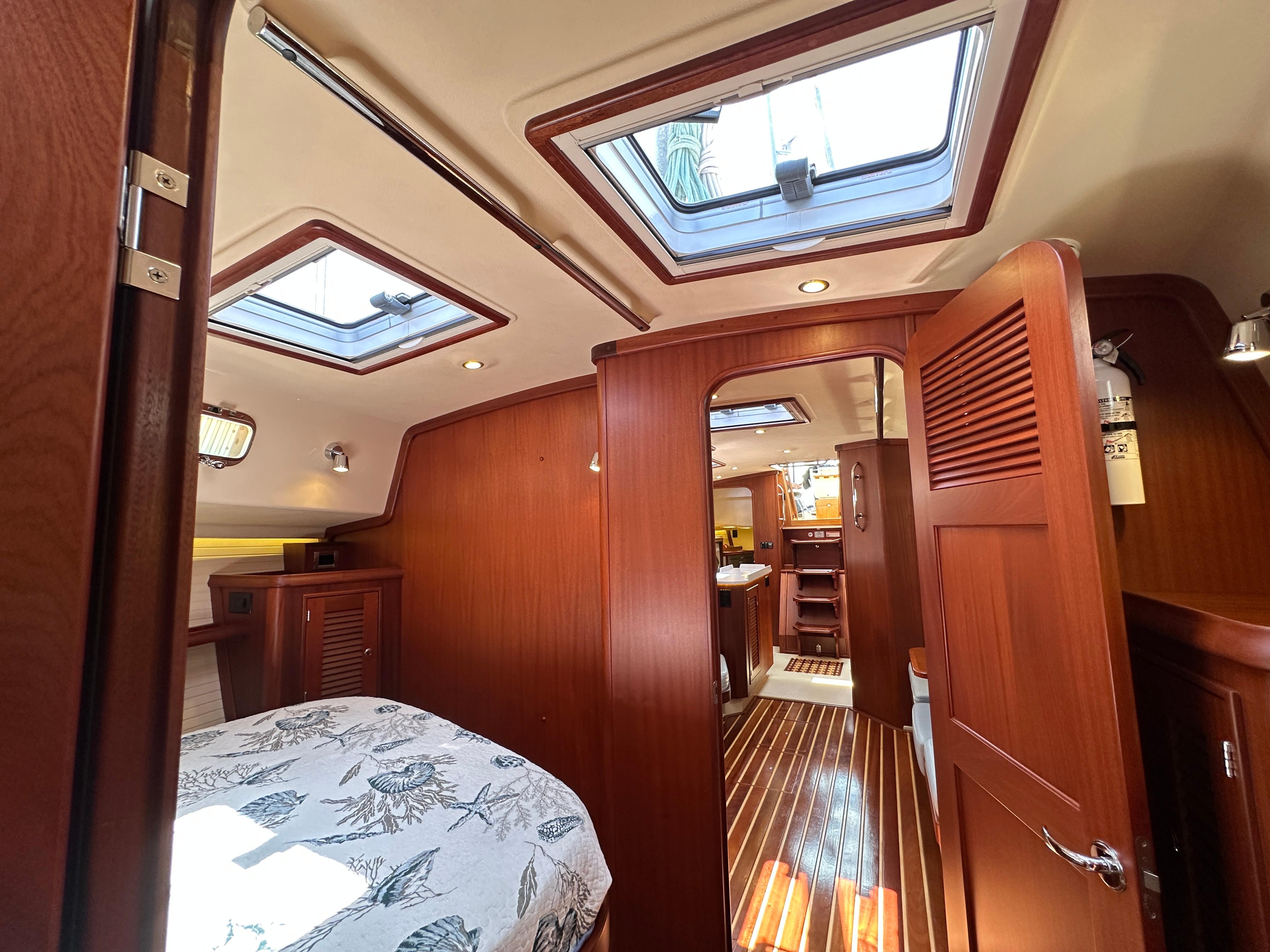 Interior of 2021 Island Packet 439 yacht with wood finish and skylights.