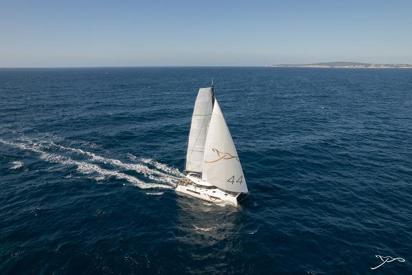 2025 Nautitech 44 Open sailing on open sea under clear blue sky.