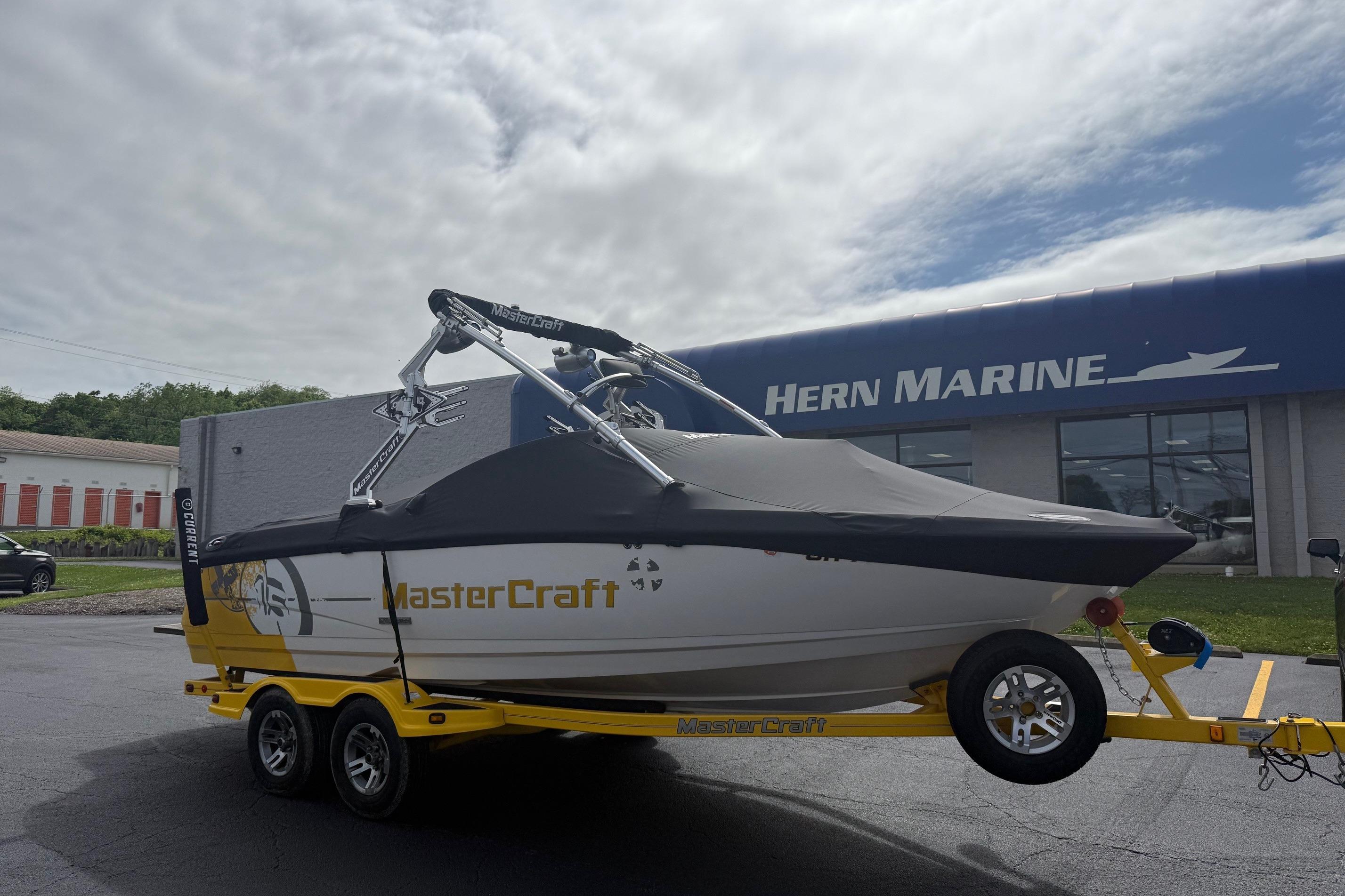 2008 MasterCraft X-15 boat on trailer at Hern Marine dealership.