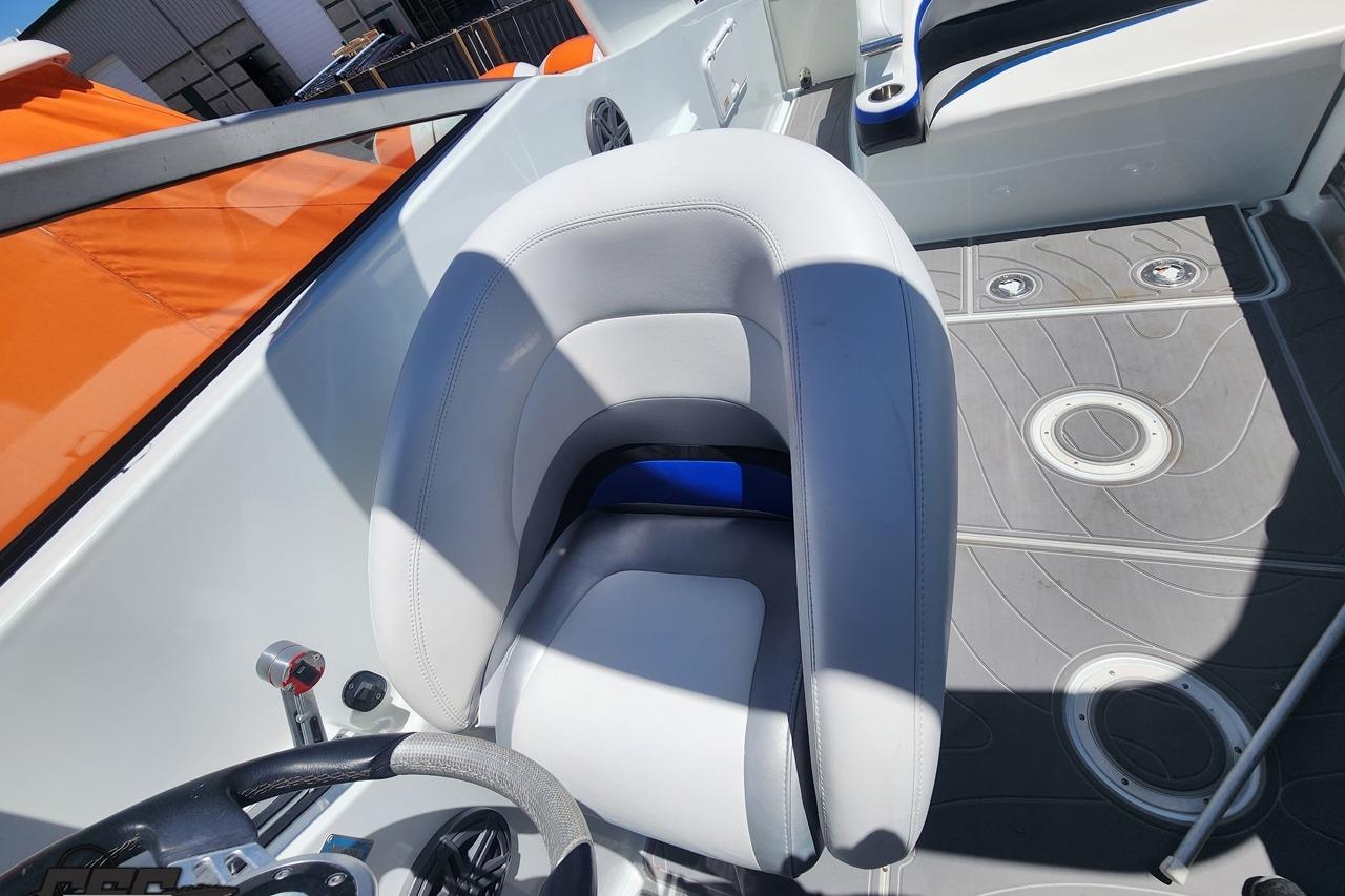 2008 Baja 335 Performance boat interior with white seating and modern dashboard.