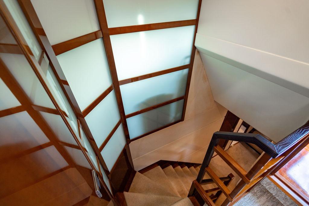 Staircase with wooden accents inside 2010 Princess 95 Motor Yacht.
