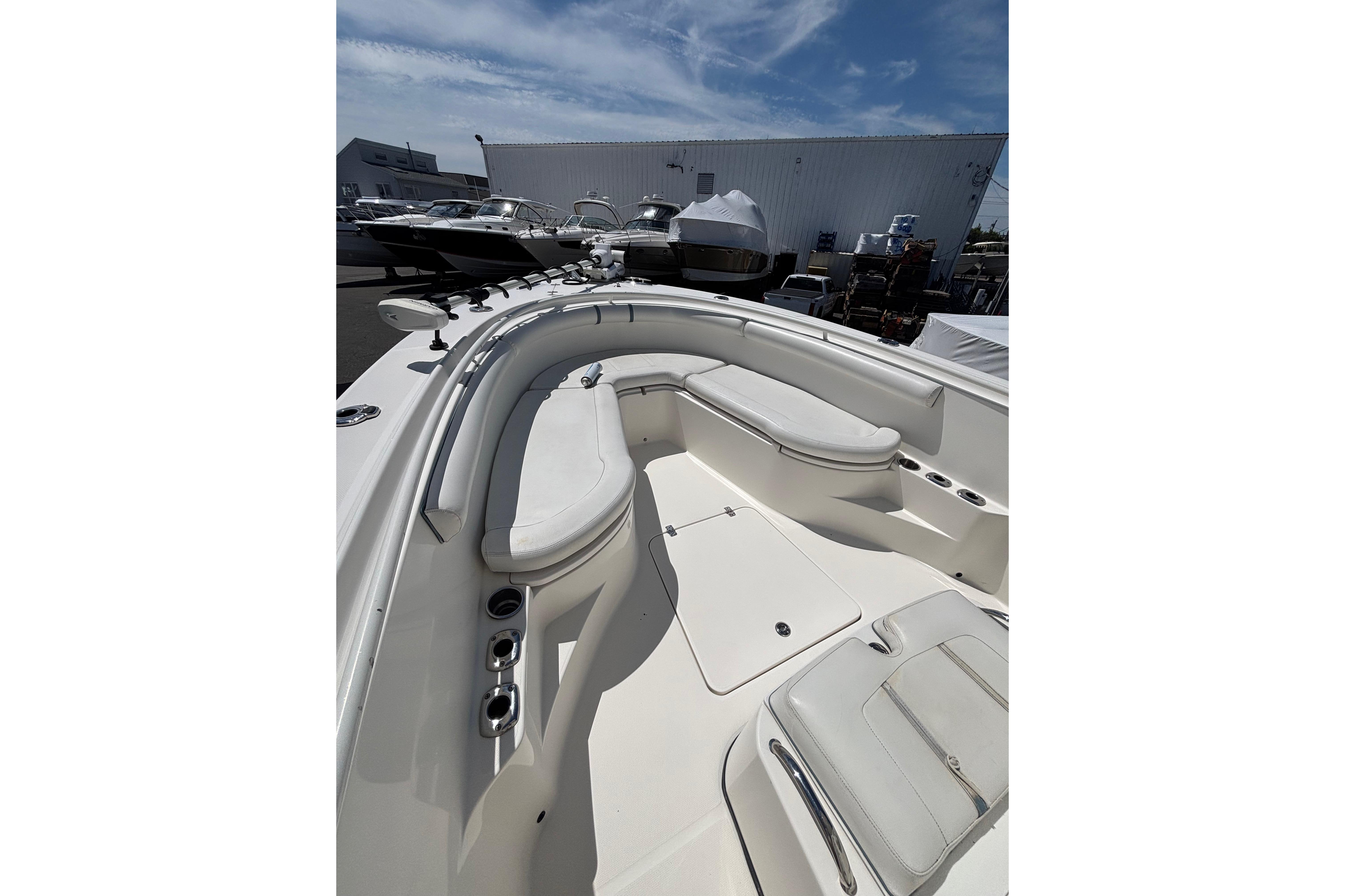 2006 Edgewater 318CC boat interior with white seating and storage compartments.