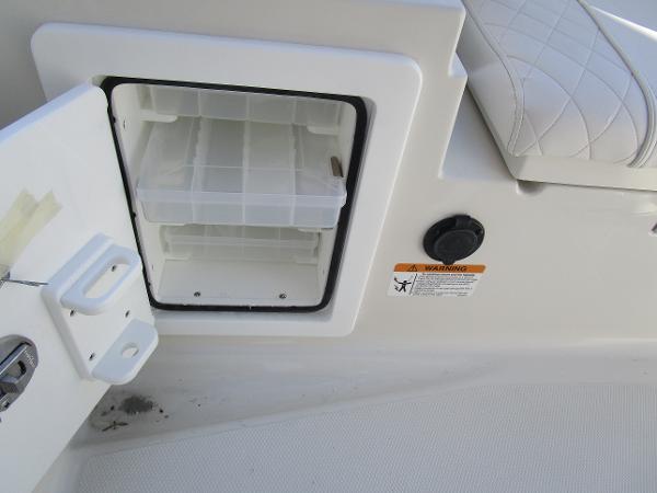 2024 Ranger 2660 Bay boat storage compartment with open door and warning label.