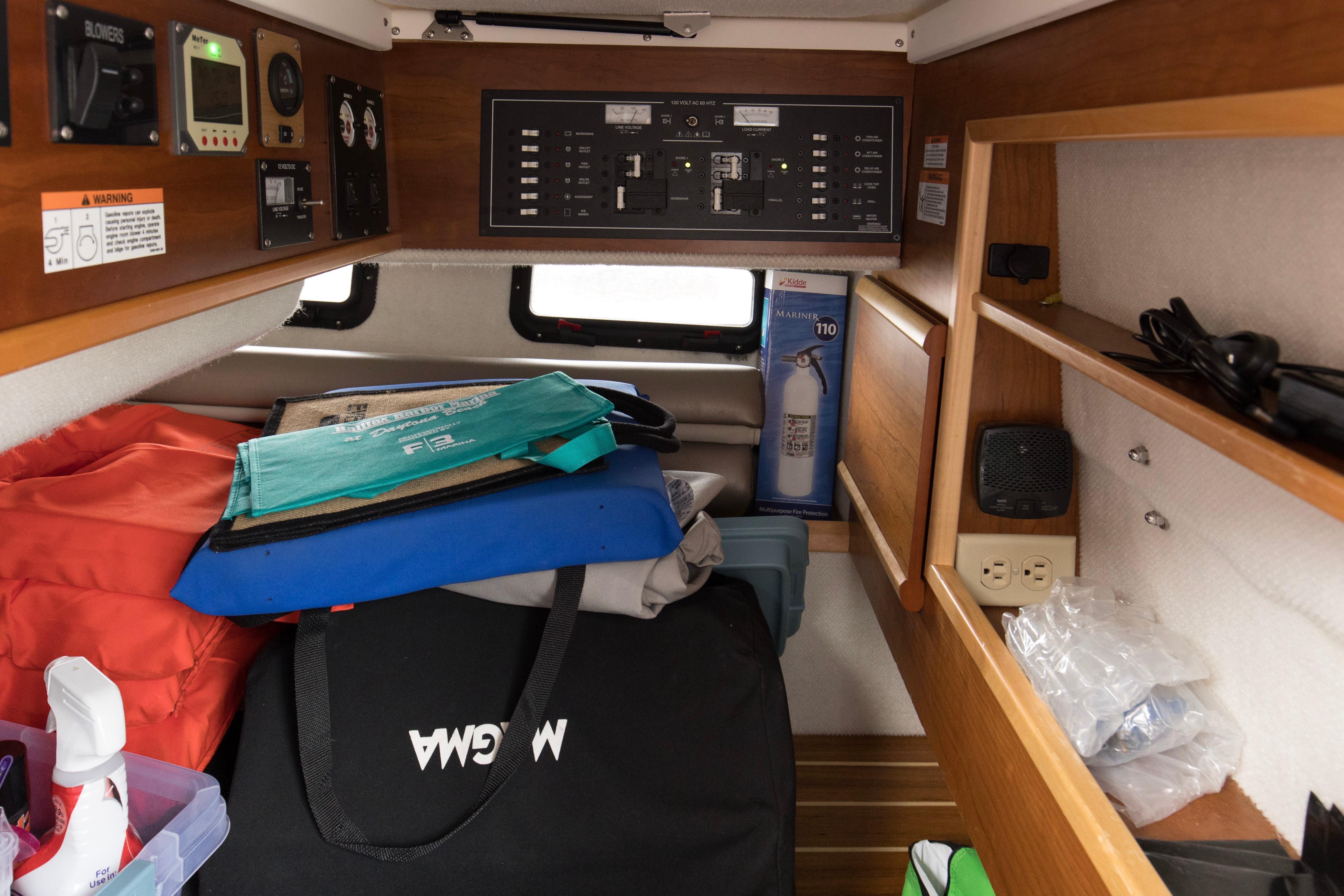 2021 Cutwater C-32 CB cabin interior with storage, control panel, and safety equipment.