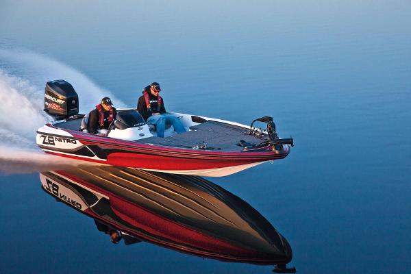 Manufacturer Provided Image: 2013 Nitro Z-8 boat speeding on calm water, reflecting vividly.