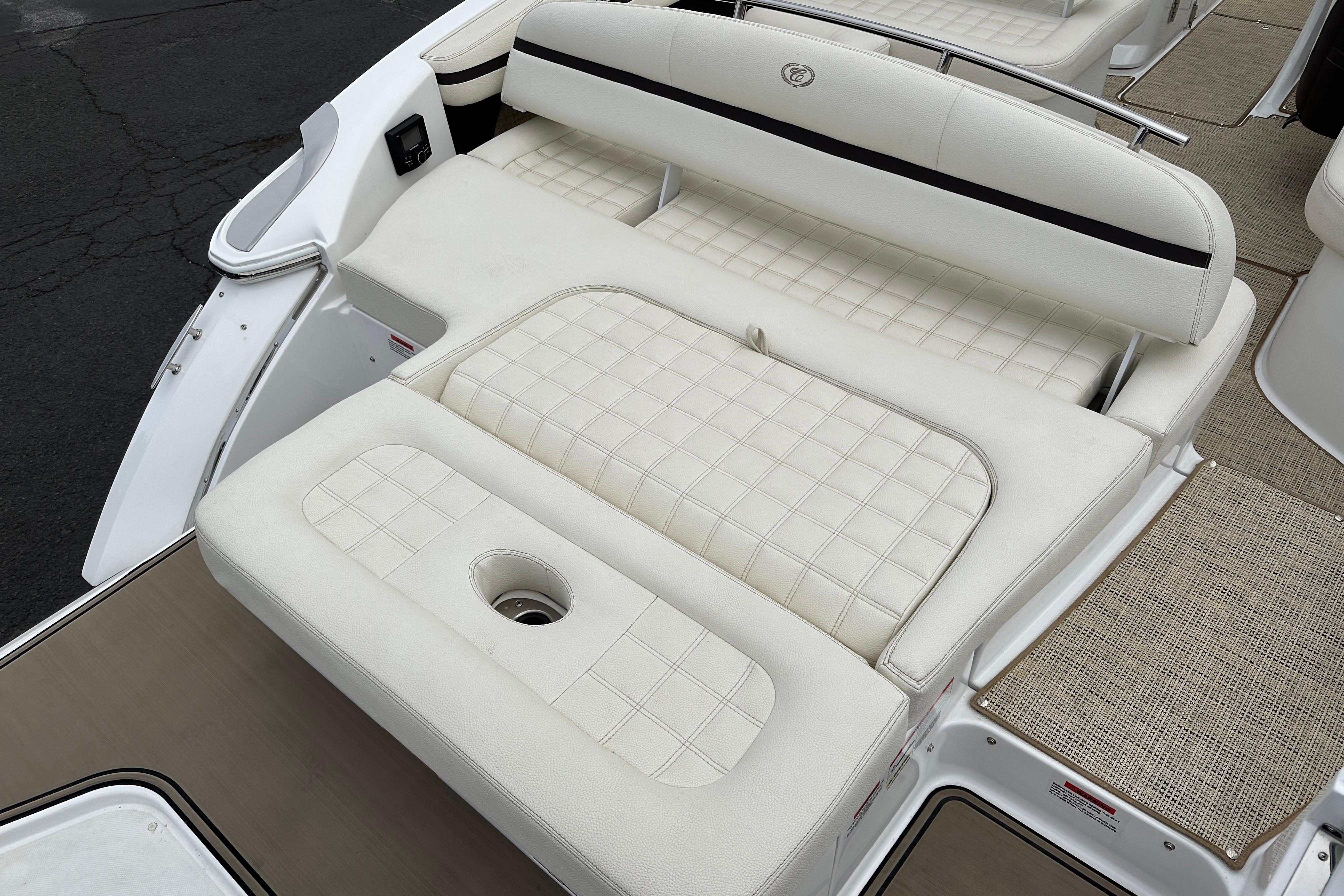 2019 Cobalt R5 boat with white cushioned seating and integrated cup holder.