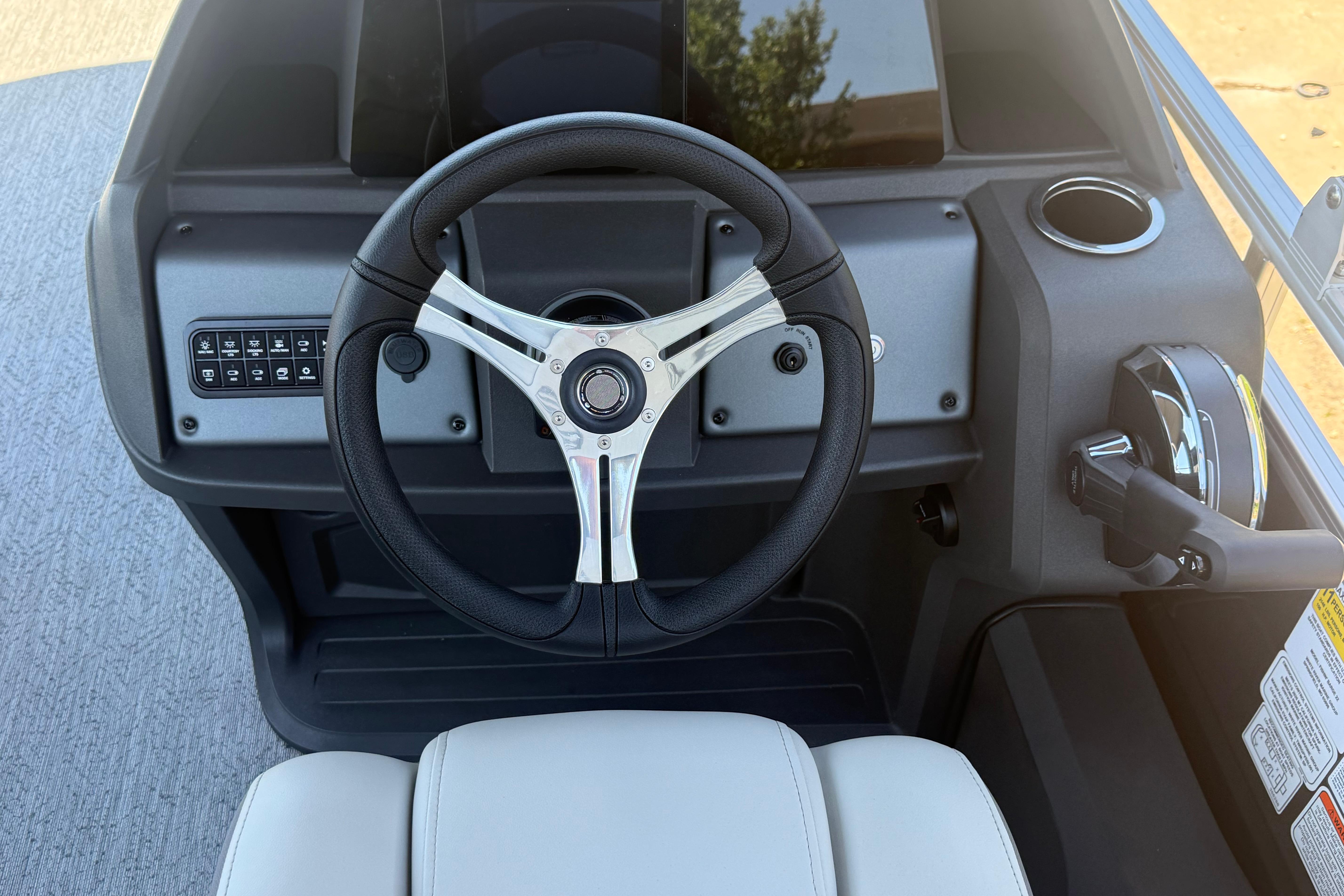 Steering console of 2026 Sun Tracker Fishin' Barge 22 DLX pontoon boat.
