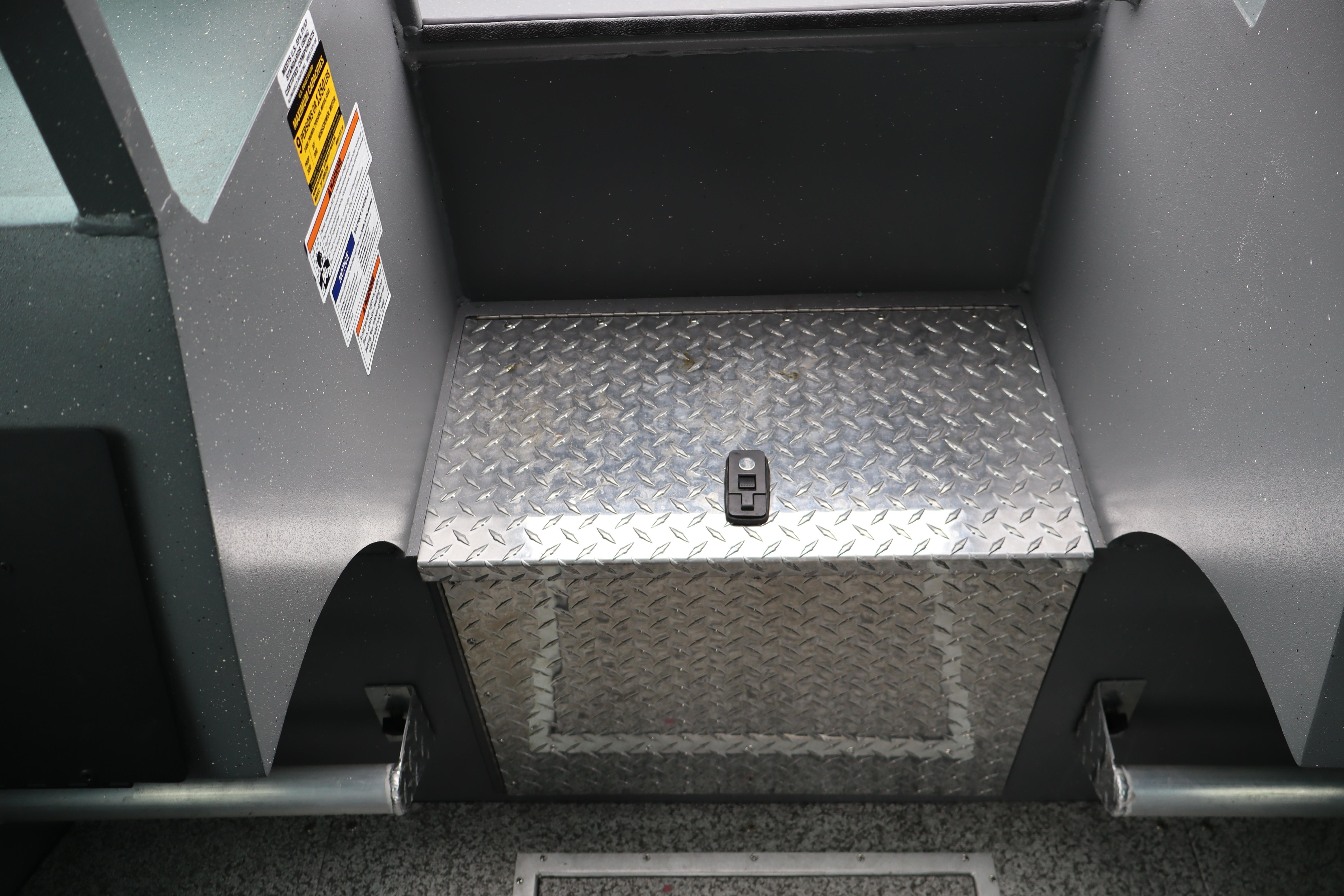 Alumaweld Horizon 24 boat interior, featuring diamond plate step and safety labels, 2026 model.