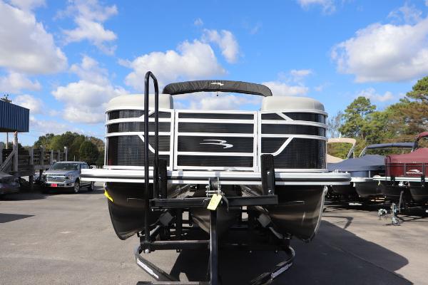 2024 Bennington 20 SL pontoon boat under a clear blue sky.