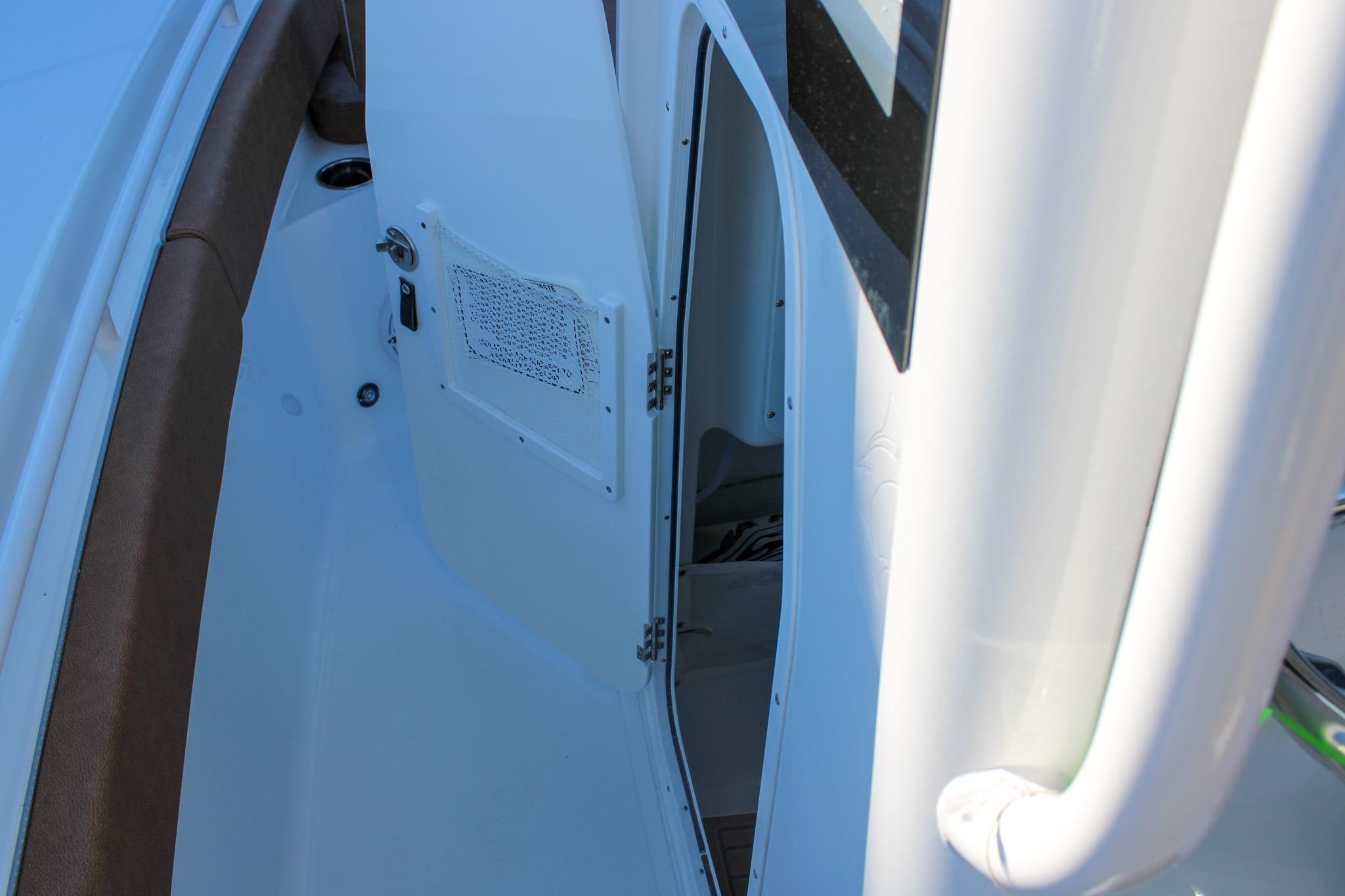 2026 Sea Hunt Gamefish 25 interior view with open cabin door.