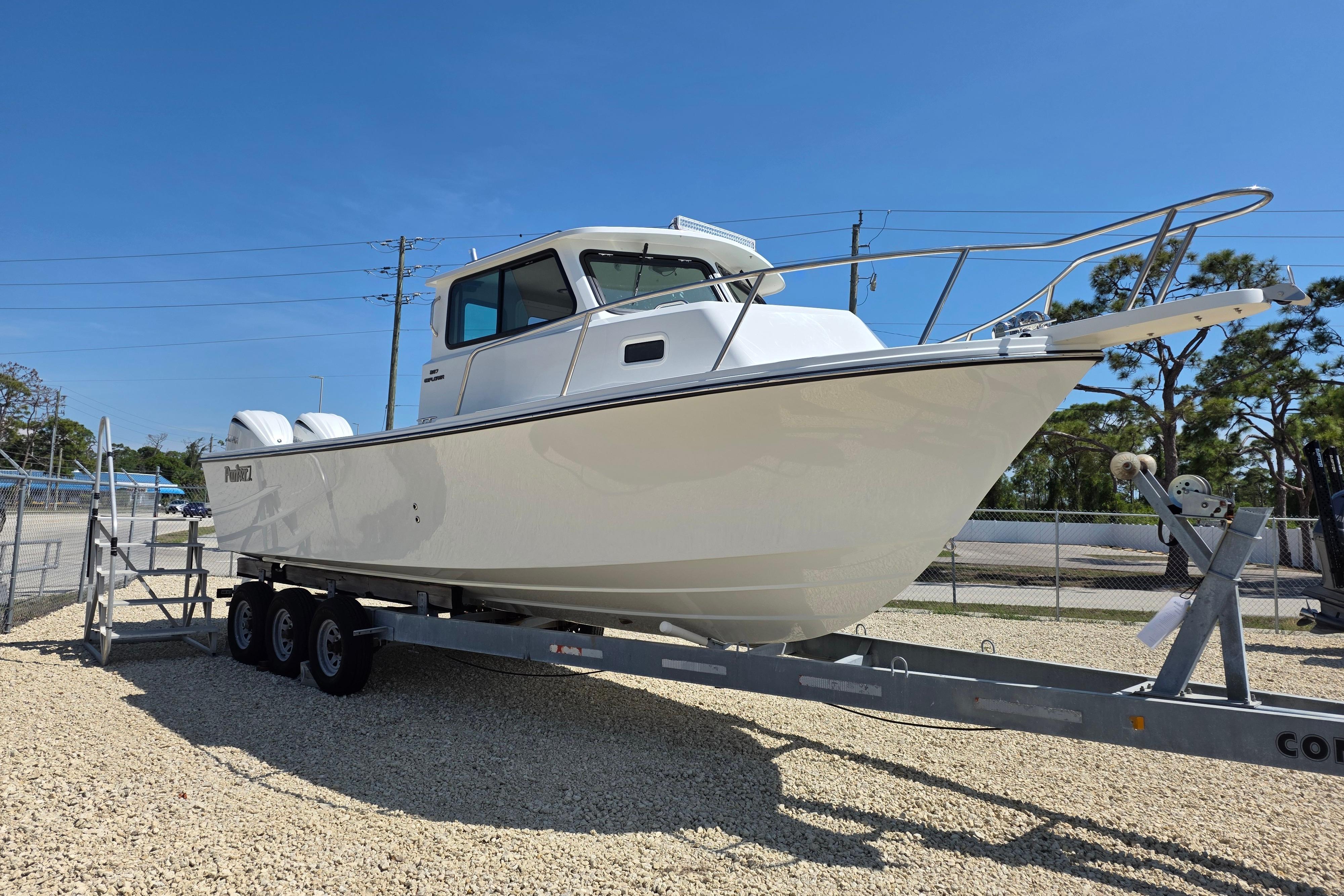 2026 Parker 287 Explorer boat on trailer under clear blue sky.