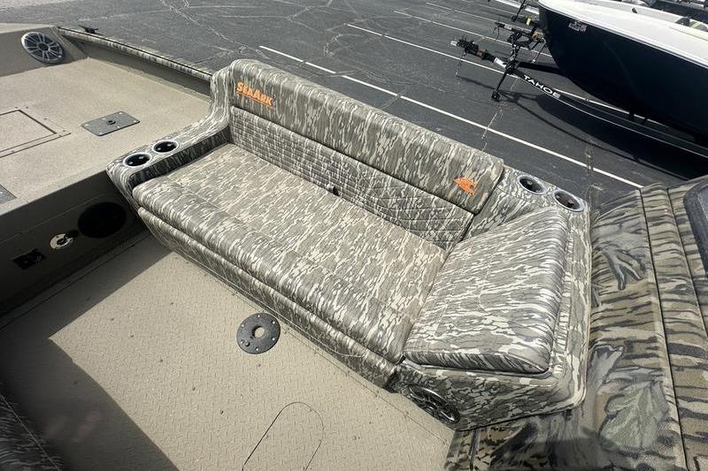 2026 SeaArk EasyCat boat with camouflage seating and cup holders on deck.