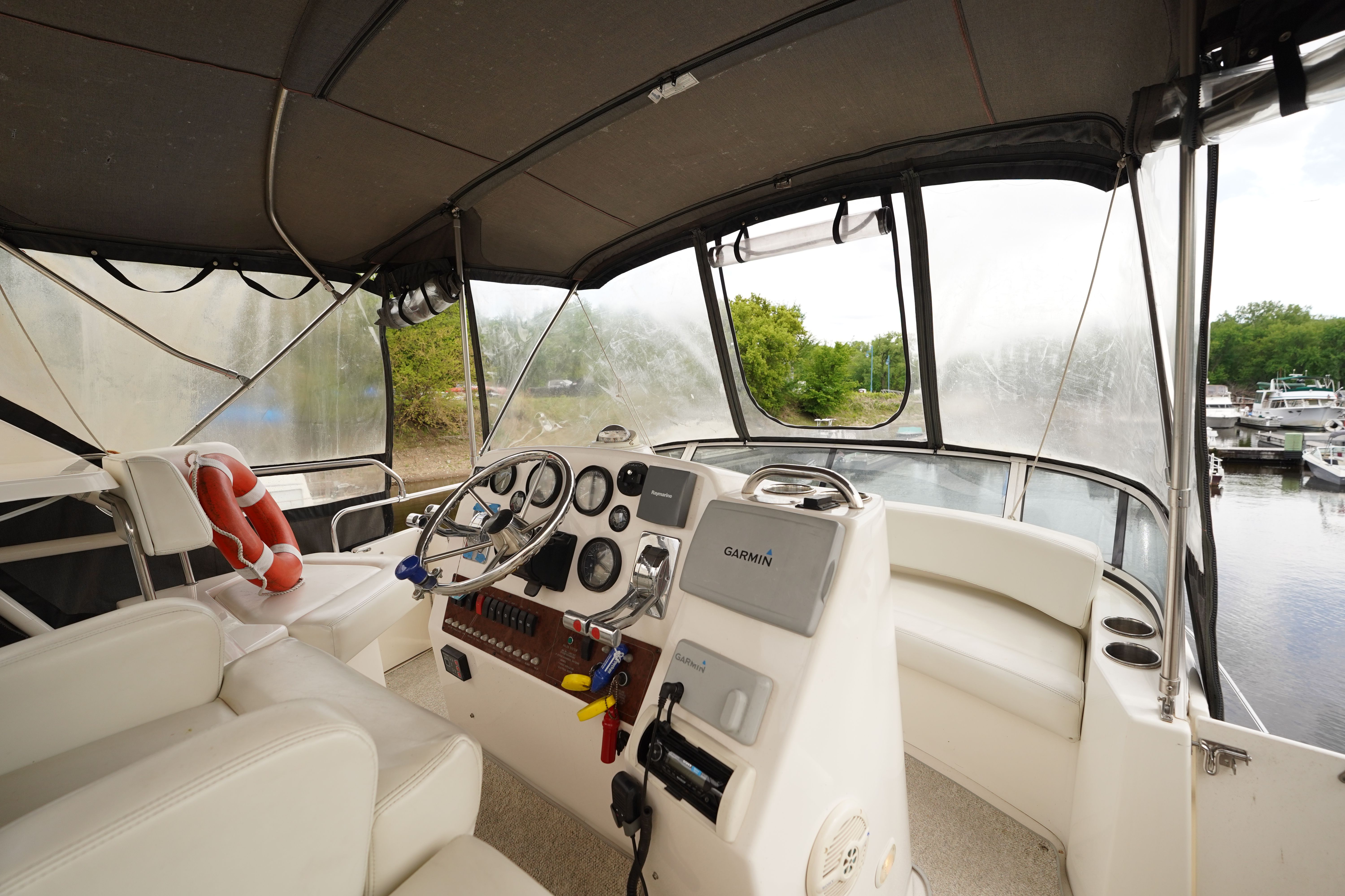 Interior of a 2002 Silverton 352 Motor Yacht with helm and seating.